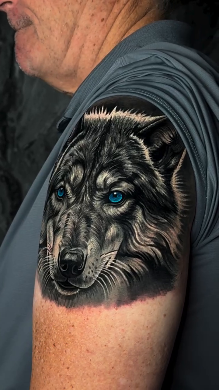Wolf portrait realism tattoo by Michael Sosa