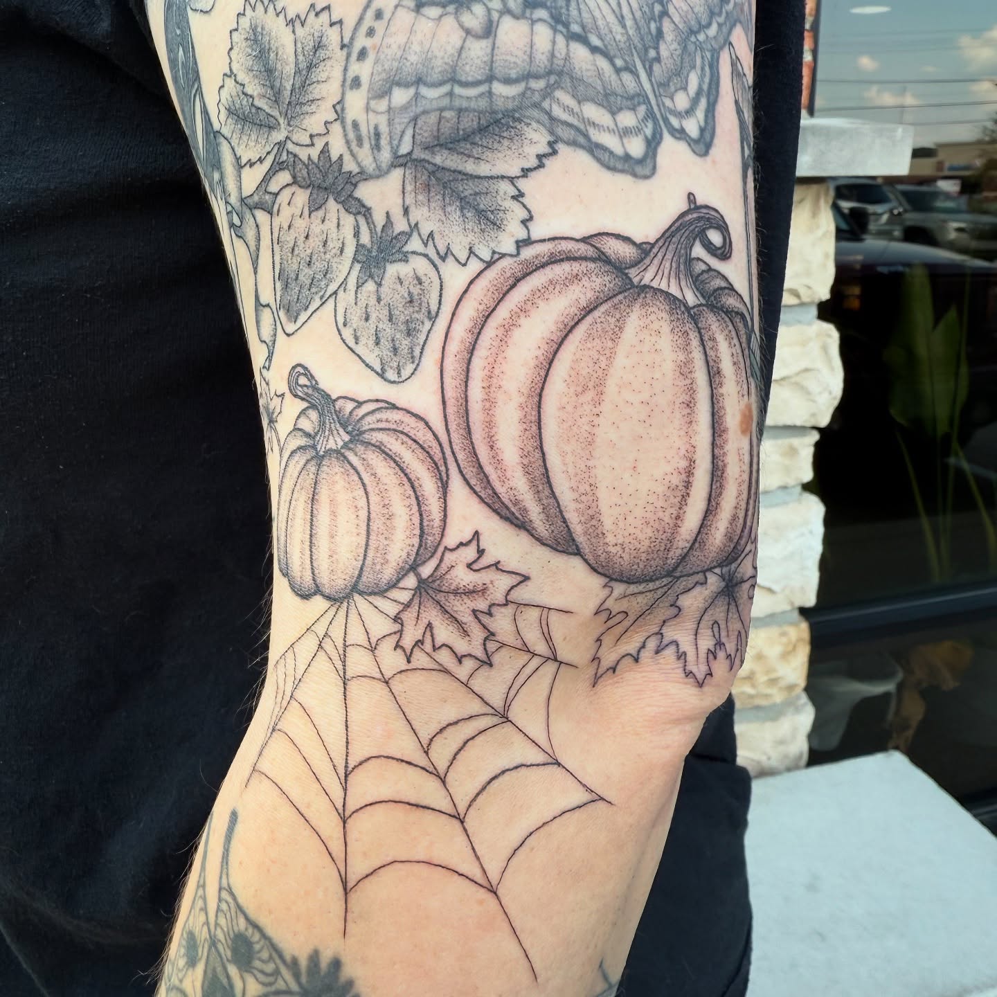 Pumpkins and spiderweb dotwork tattoo on the forearm by Tina Petrullo, West Chester Township, Butler County, Ohio