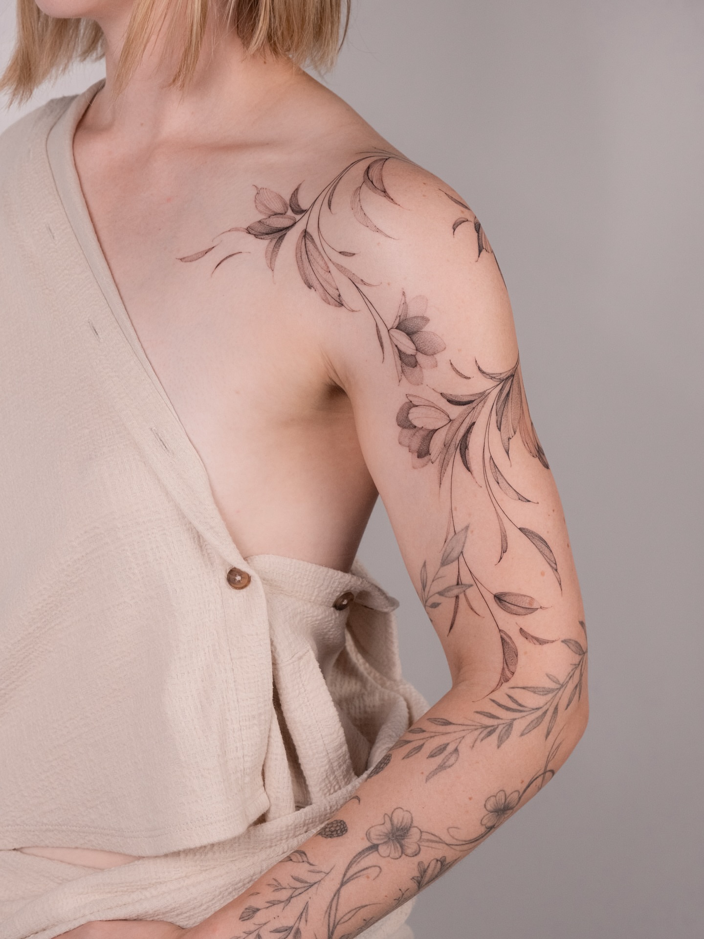 Floral vine black and grey tattoo on the upper arm by i flower you