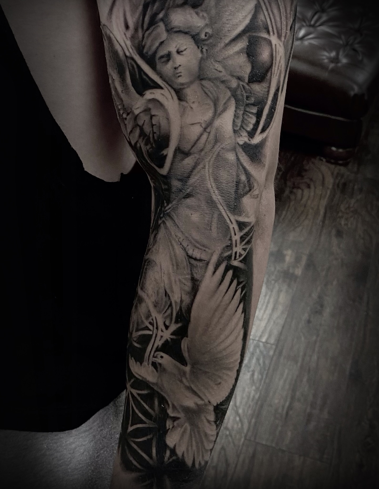 Angel with dove realism tattoo on the forearm by Brandon Bowie