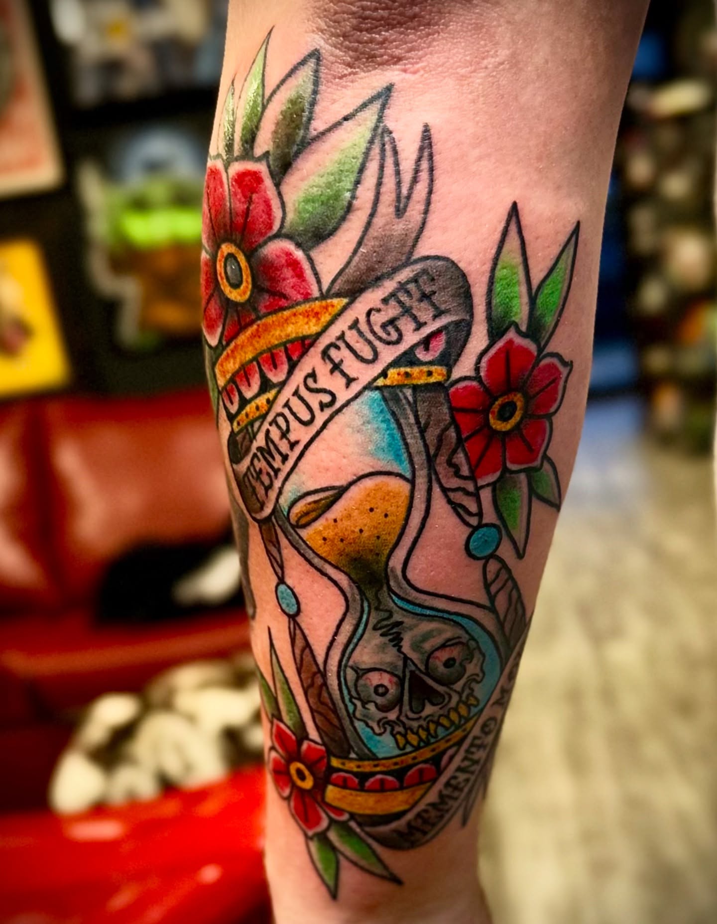 Time and flowers American traditional tattoo on the forearm by Tattoo Artist Ian Day (Everlasting_Art_Ink)