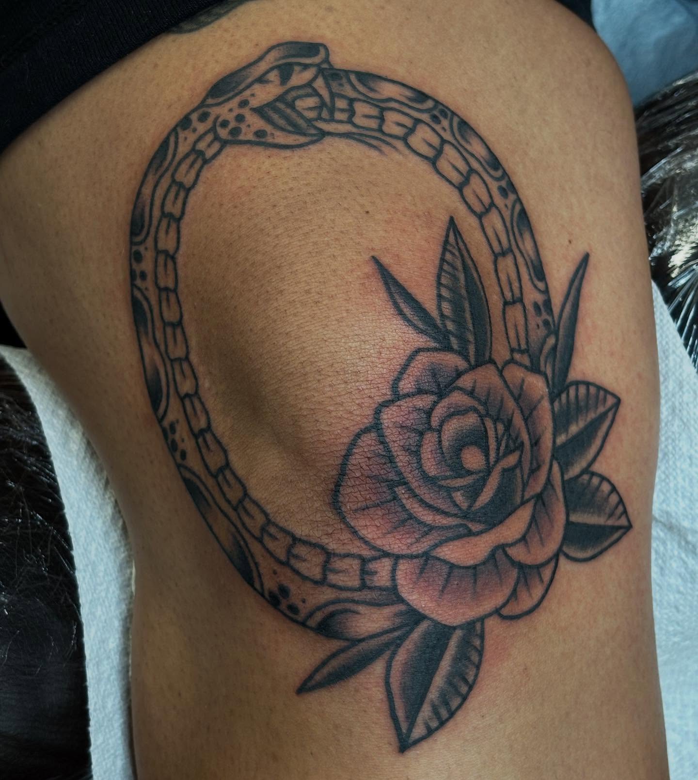 Rose and chain American traditional tattoo on the thigh by Brandi ⛓, Detroit, Michigan