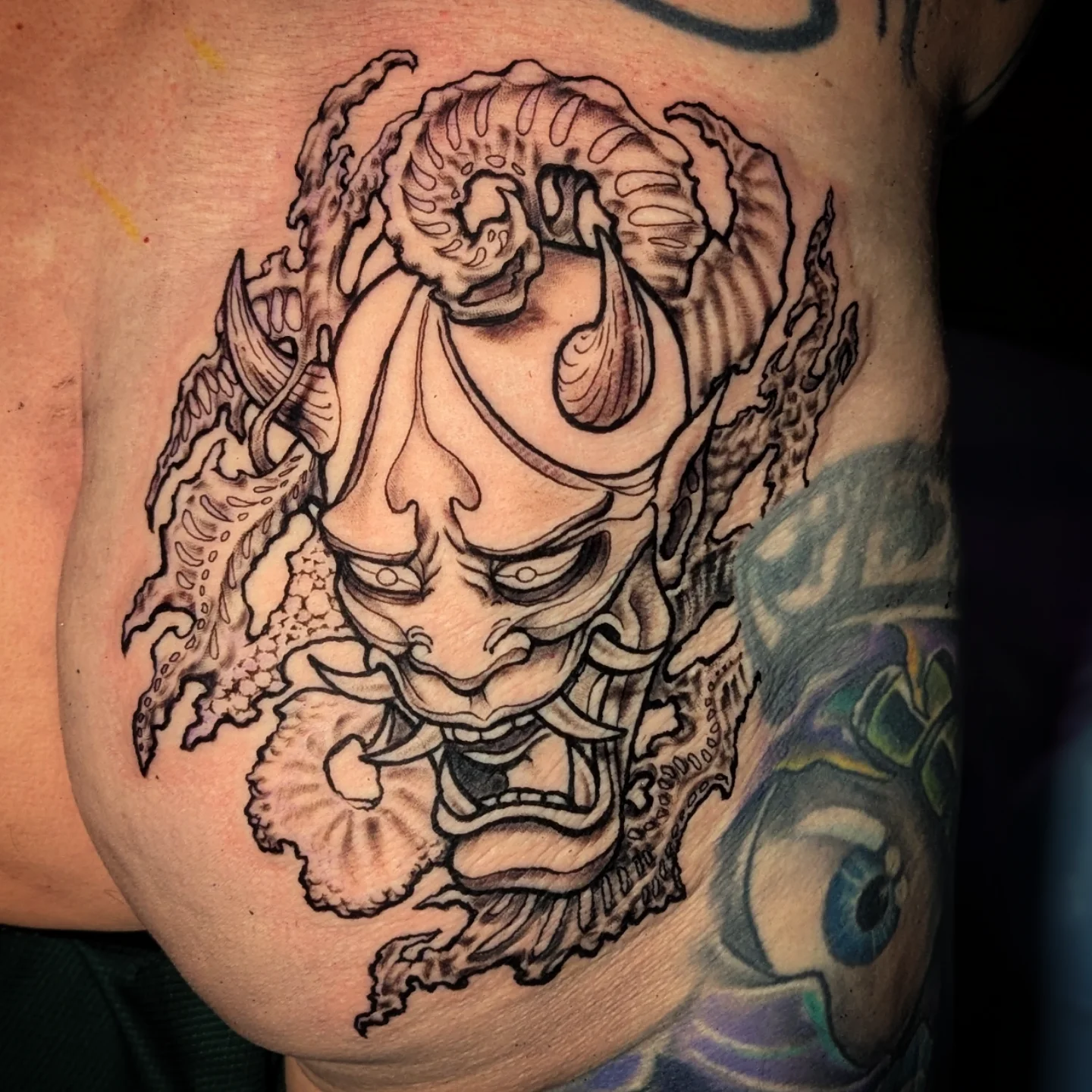 Demon mask japanese irezumi tattoo on the chest by Lorelei