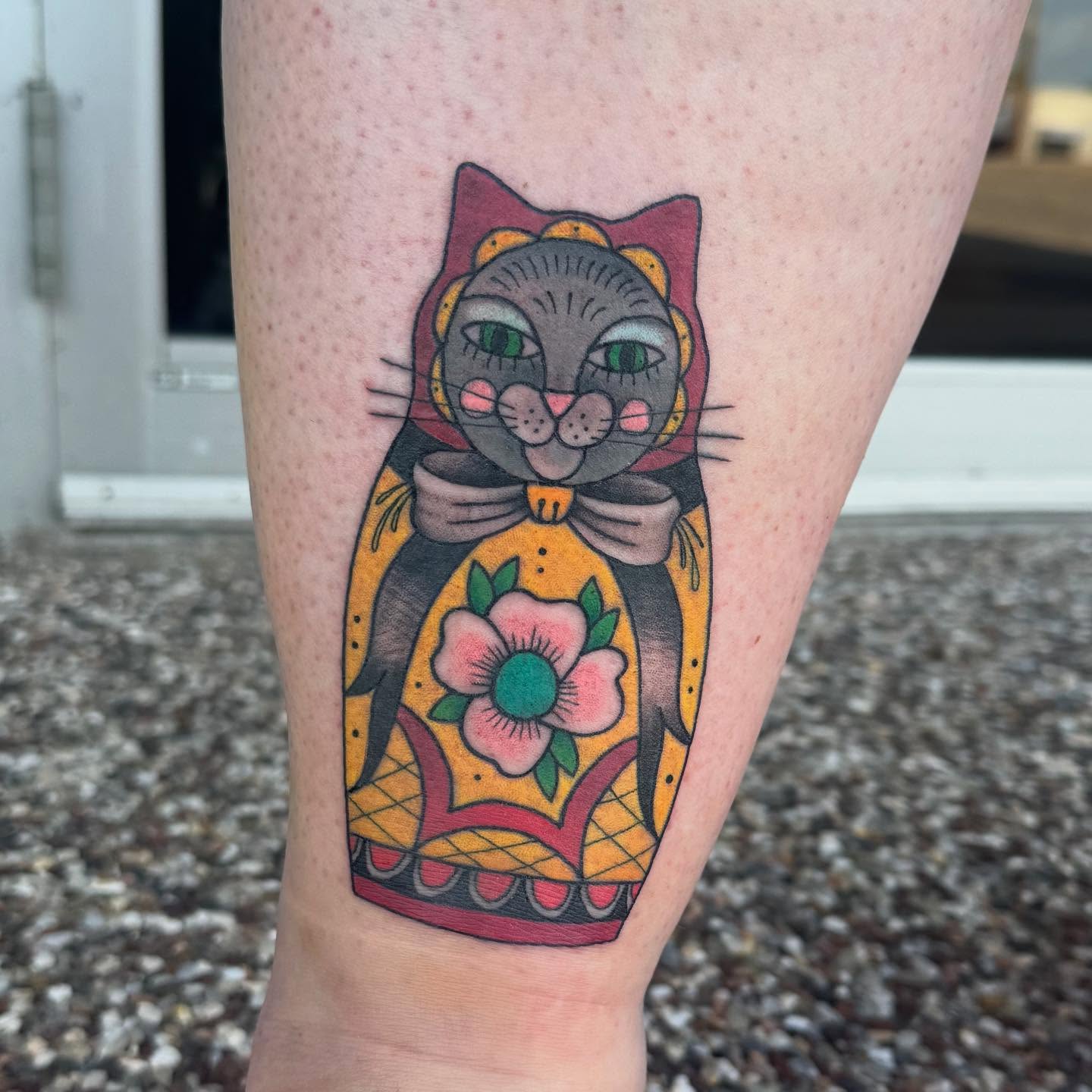 Cat in nesting doll American traditional tattoo on the forearm by Erica Rose π€