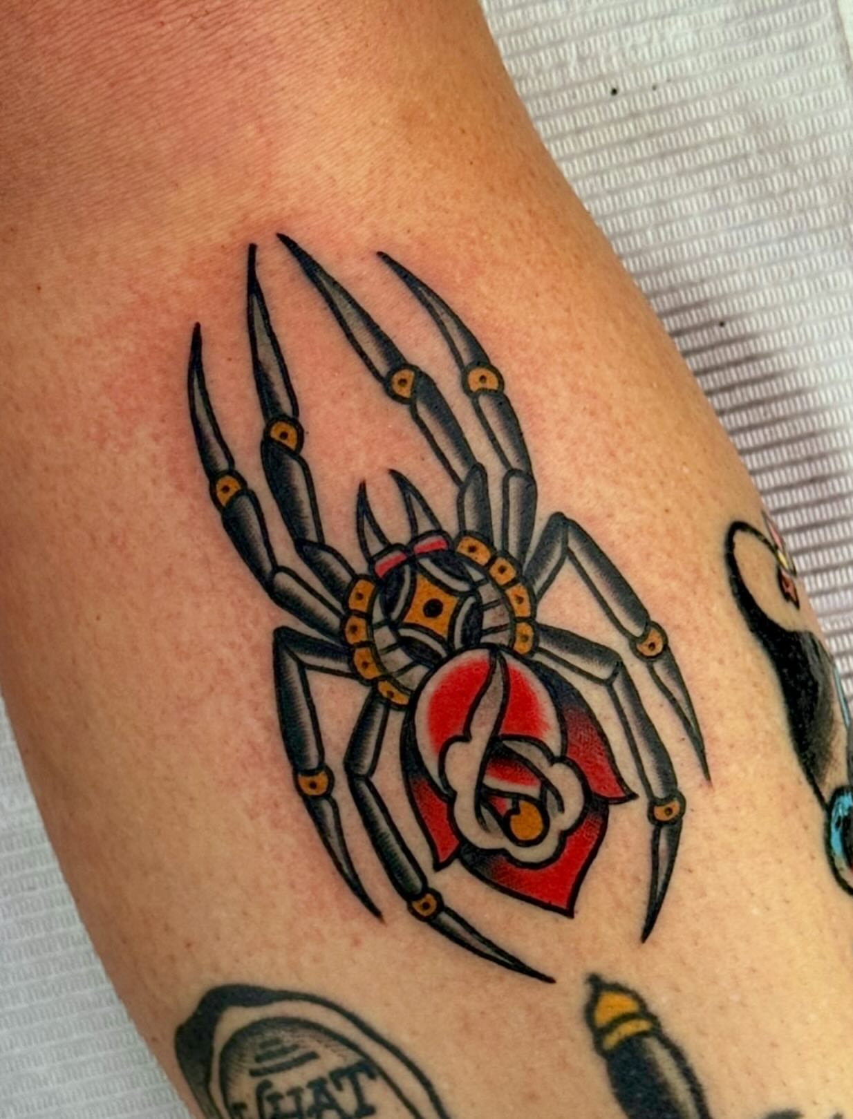 Spider American traditional tattoo on the forearm by Cory Craft