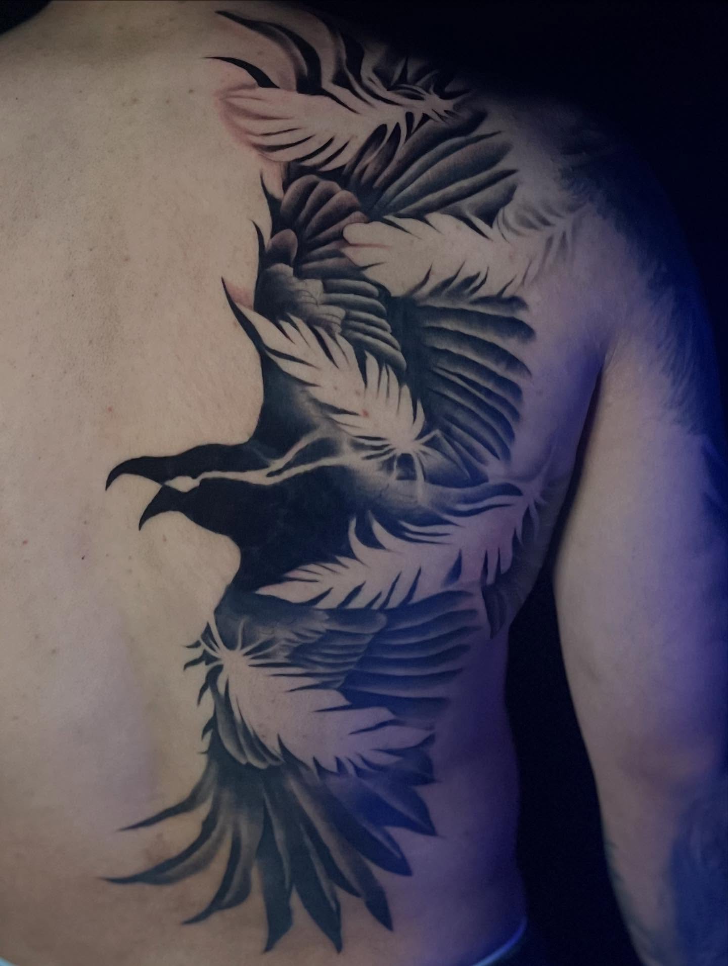 Eagle black and grey tattoo on the back by Lexi Ross