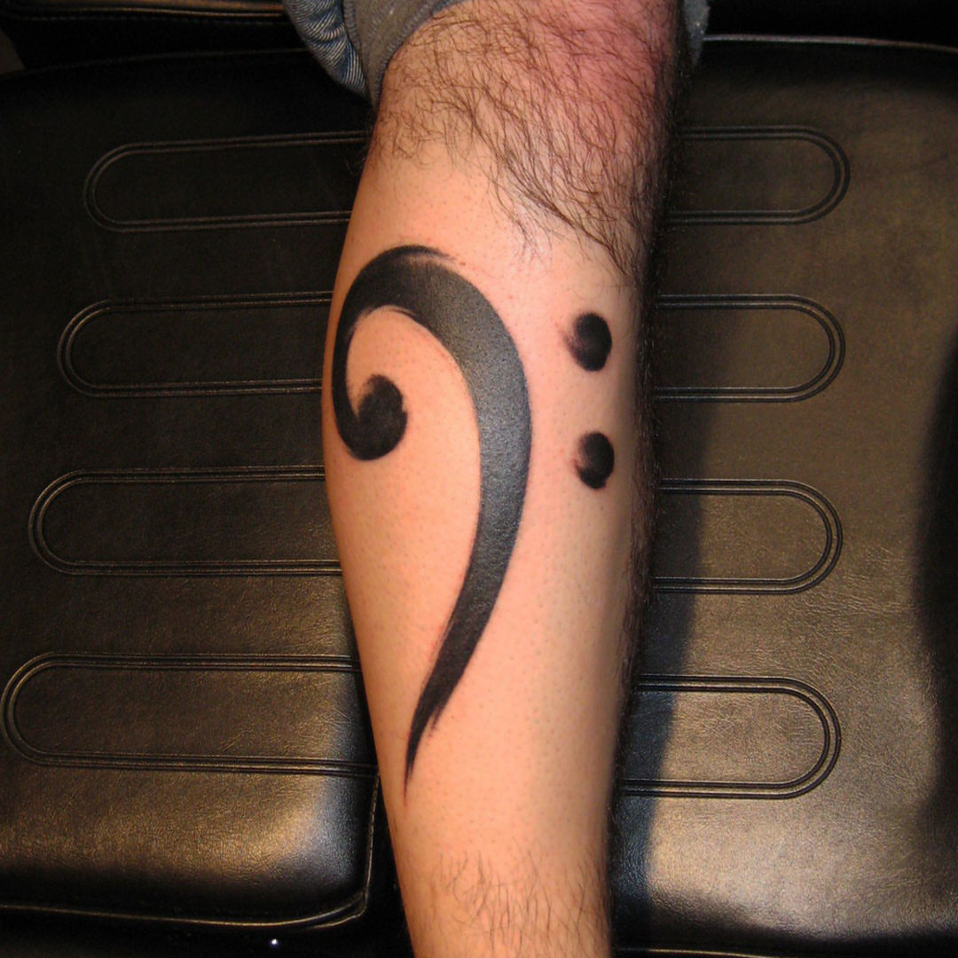 Treble clef black and grey tattoo on the forearm by Dave Chercourt, Willoughby, Ohio