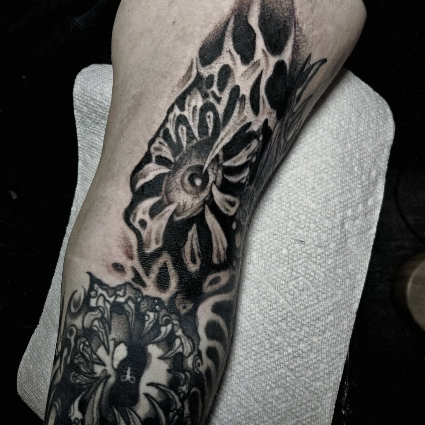Floral pattern black and grey tattoo on the forearm by Ema Fish