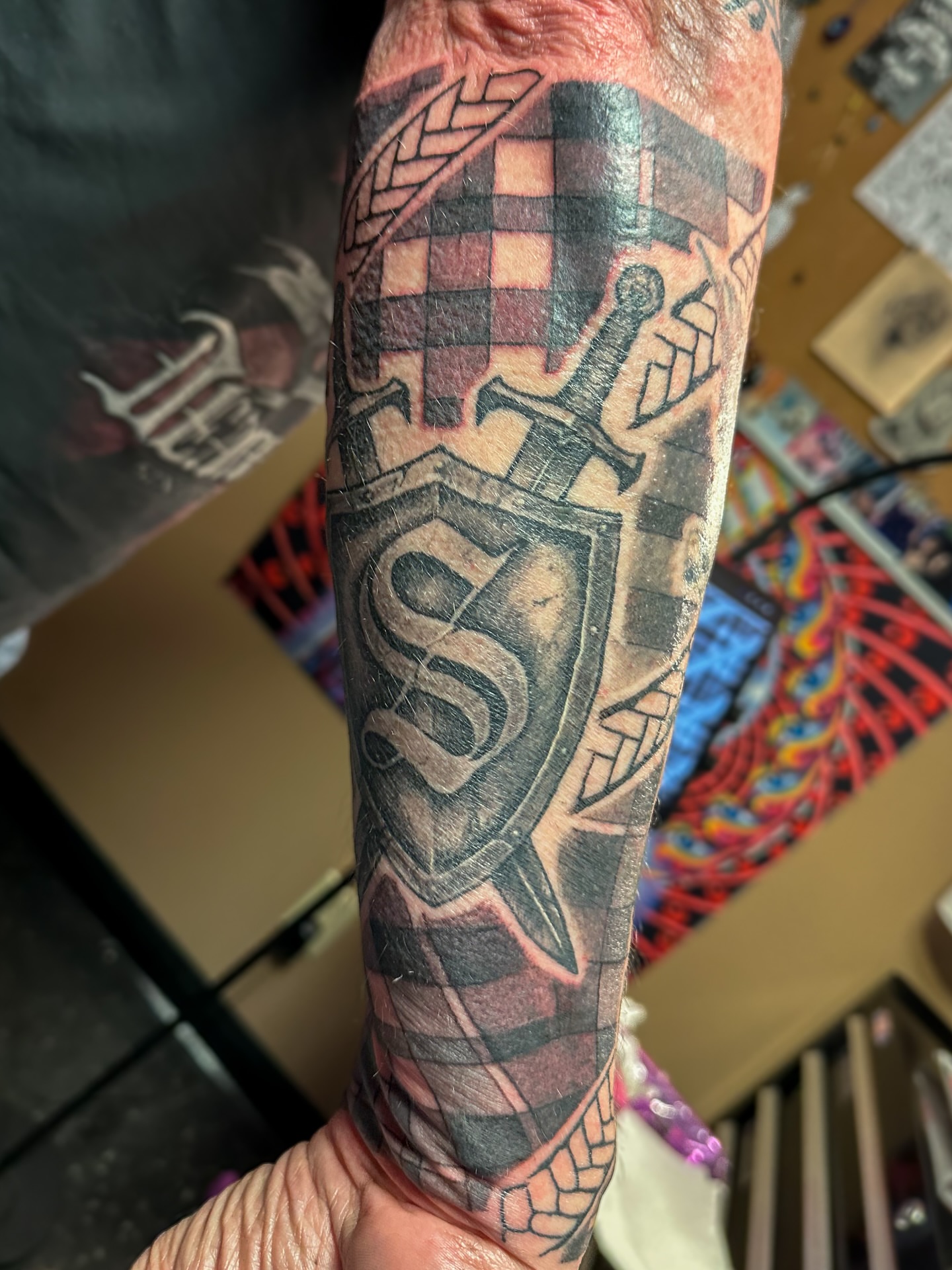 Shield and sword black and grey tattoo on the forearm by π·πππ, Cleveland, Ohio