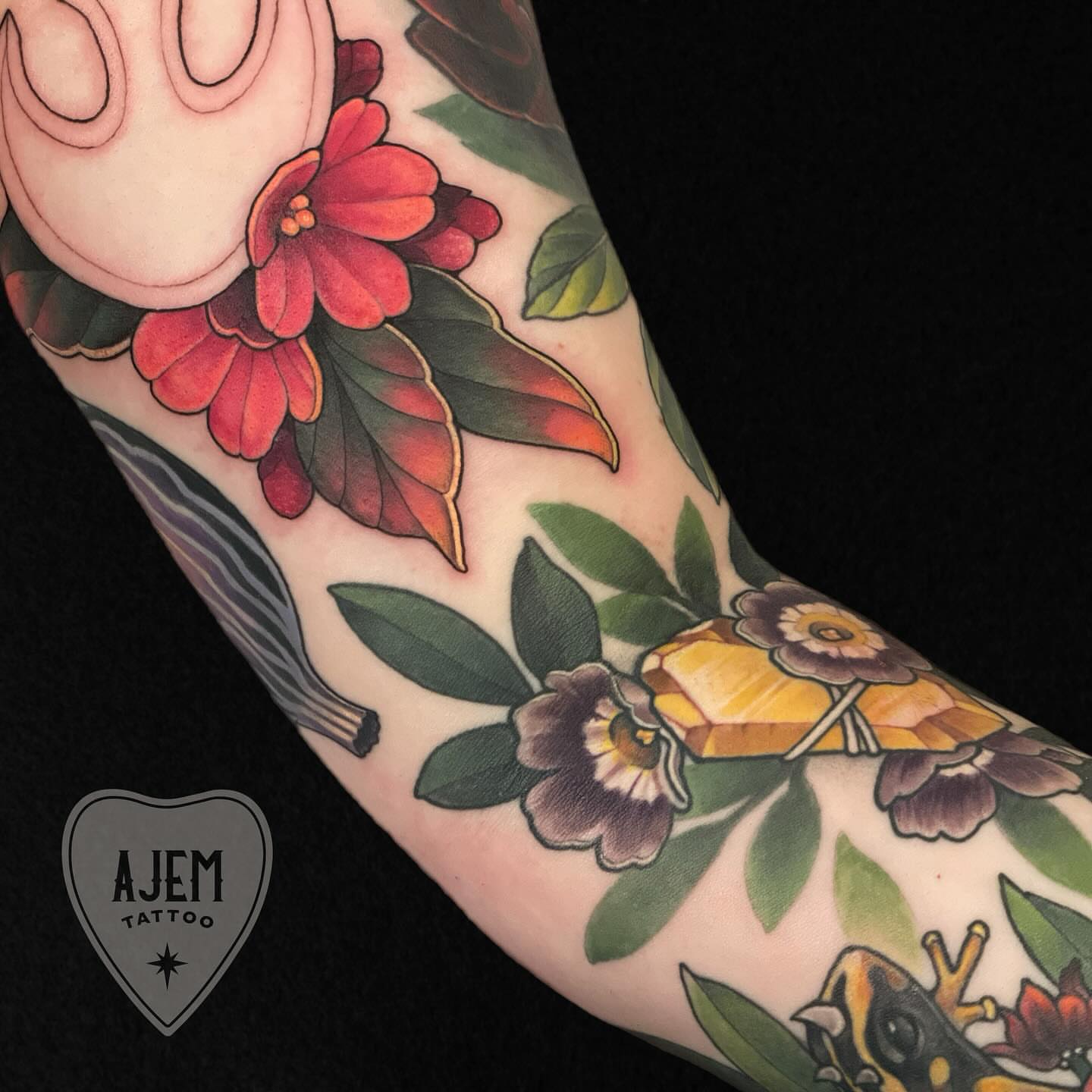 Floral arrangement American traditional tattoo on the forearm by Ash MacIsaac