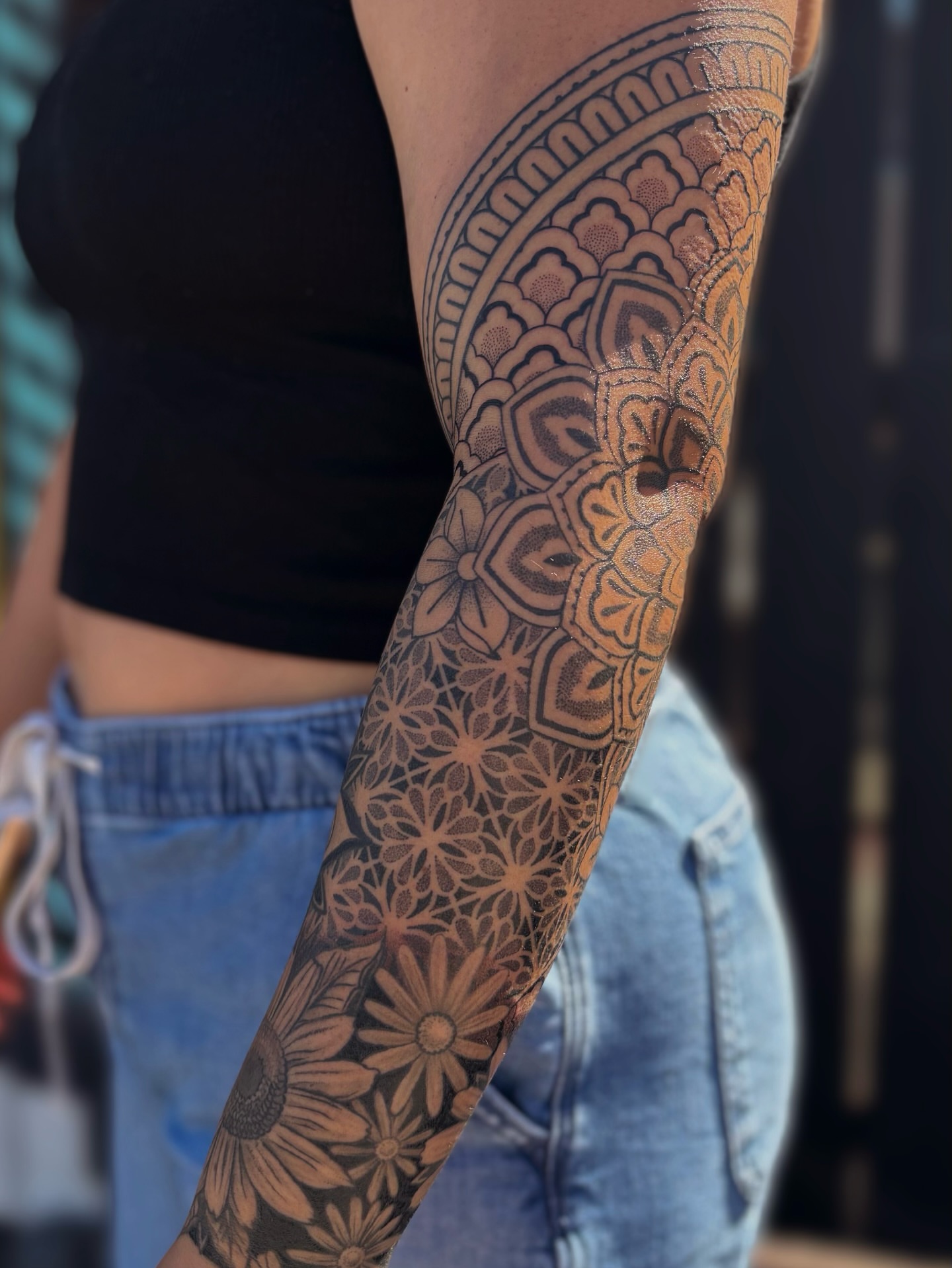 Floral mandala geometric tattoo on the forearm by Storm Smith