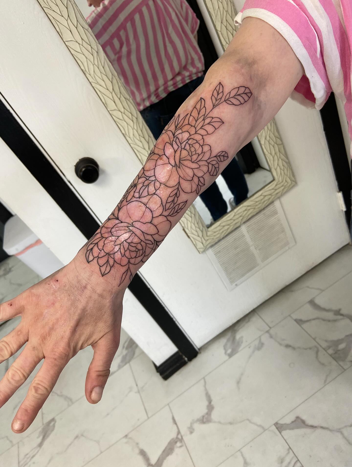 Floral bouquet black and grey tattoo on the forearm by Sophia