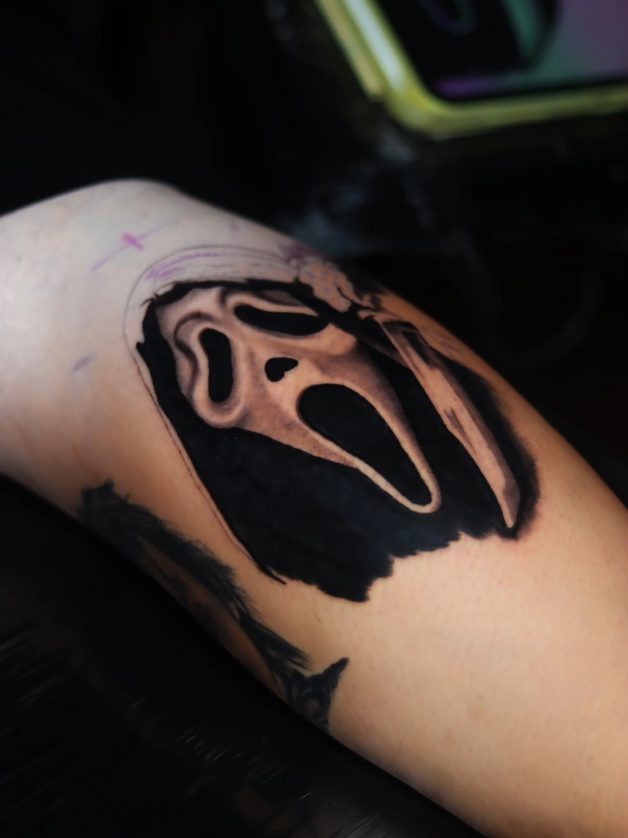 Scream mask black and grey tattoo on the forearm by Melissa C, Phoenix, Arizona