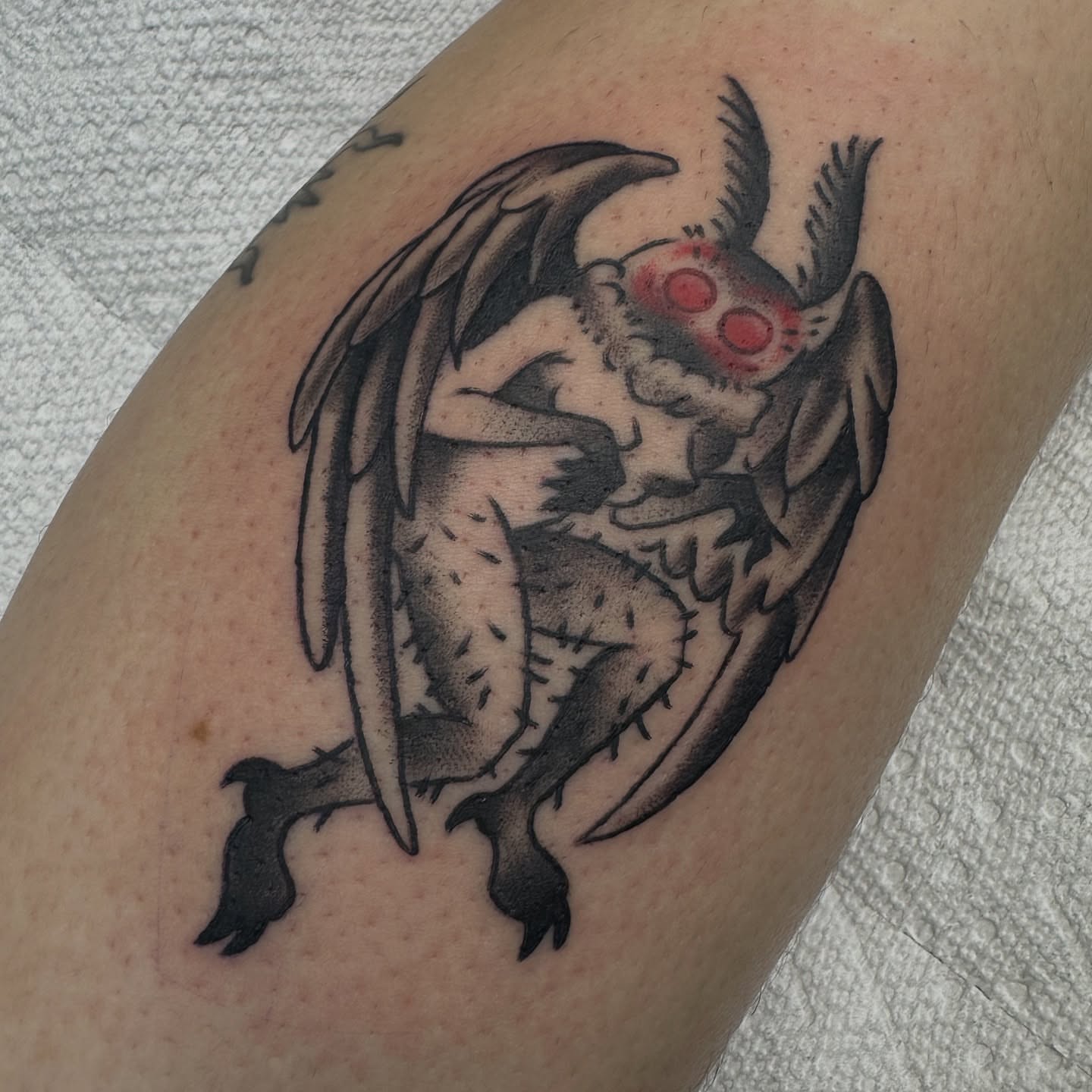 Gargoyle black and grey tattoo on the forearm by Heather Cherish