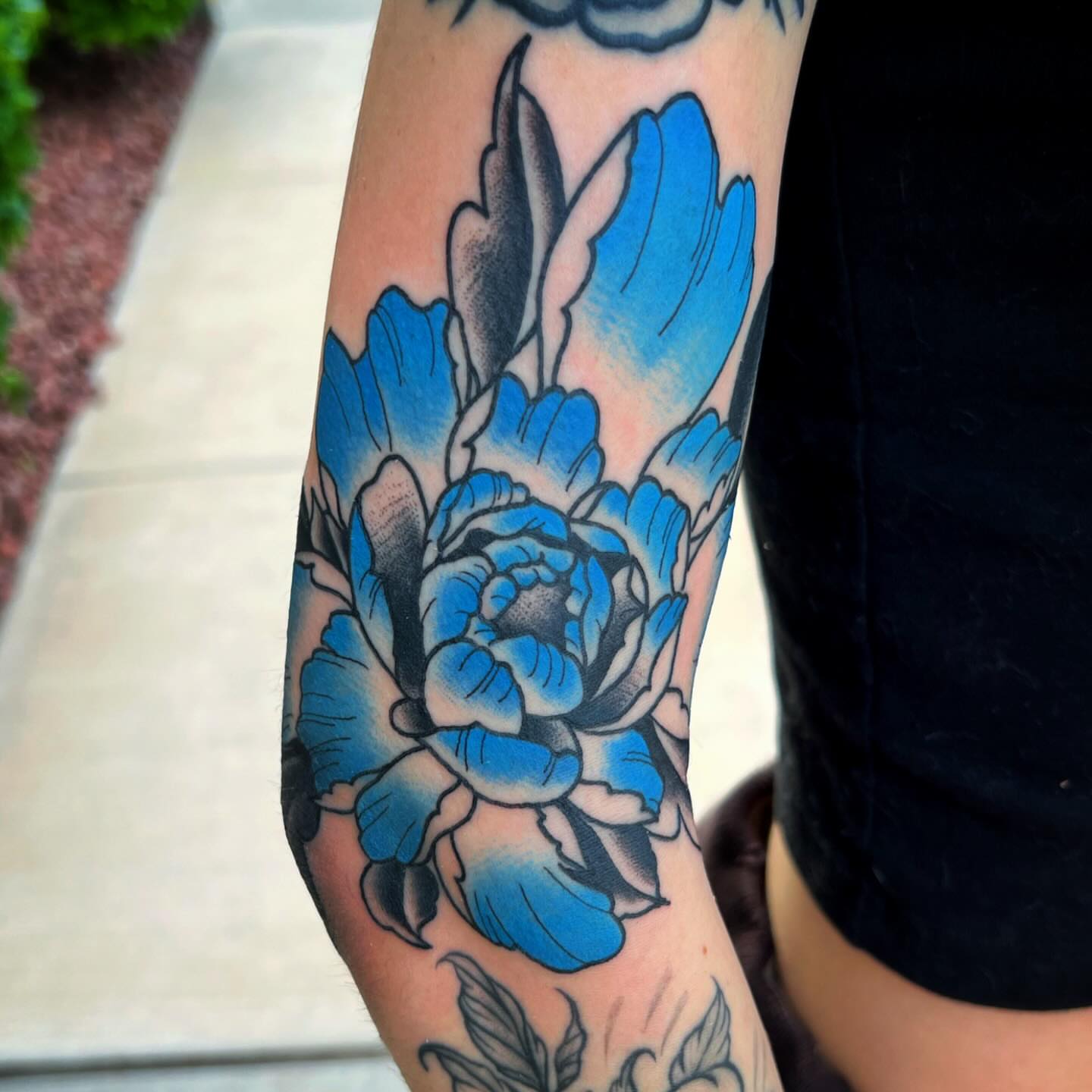Blue peony American traditional tattoo on the forearm by @sloanxkettering