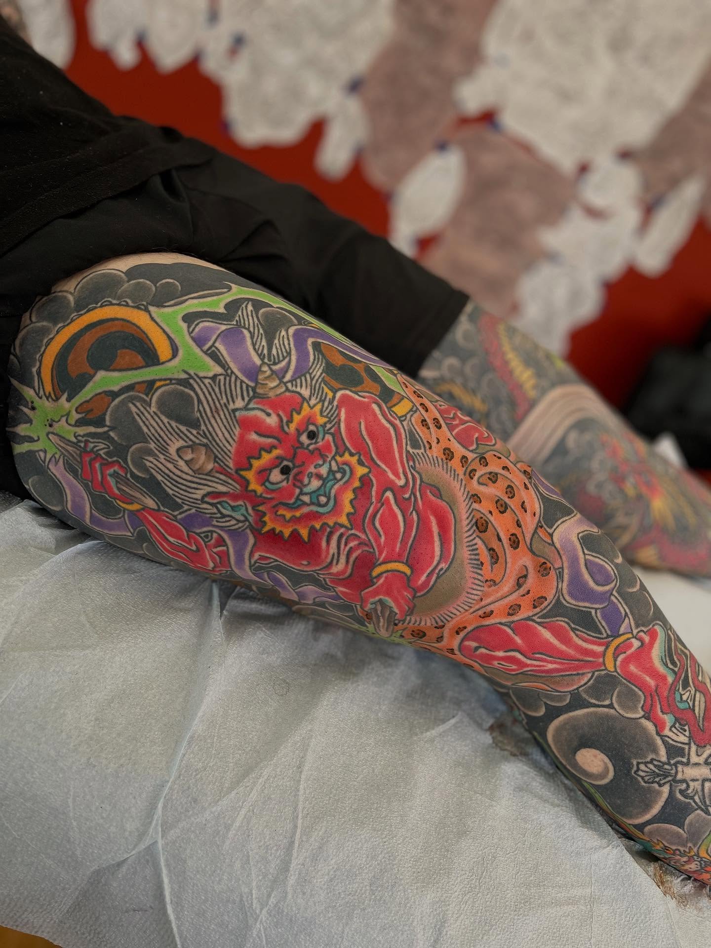 Lion and floral japanese irezumi tattoo on the leg by Matthew Crimson
