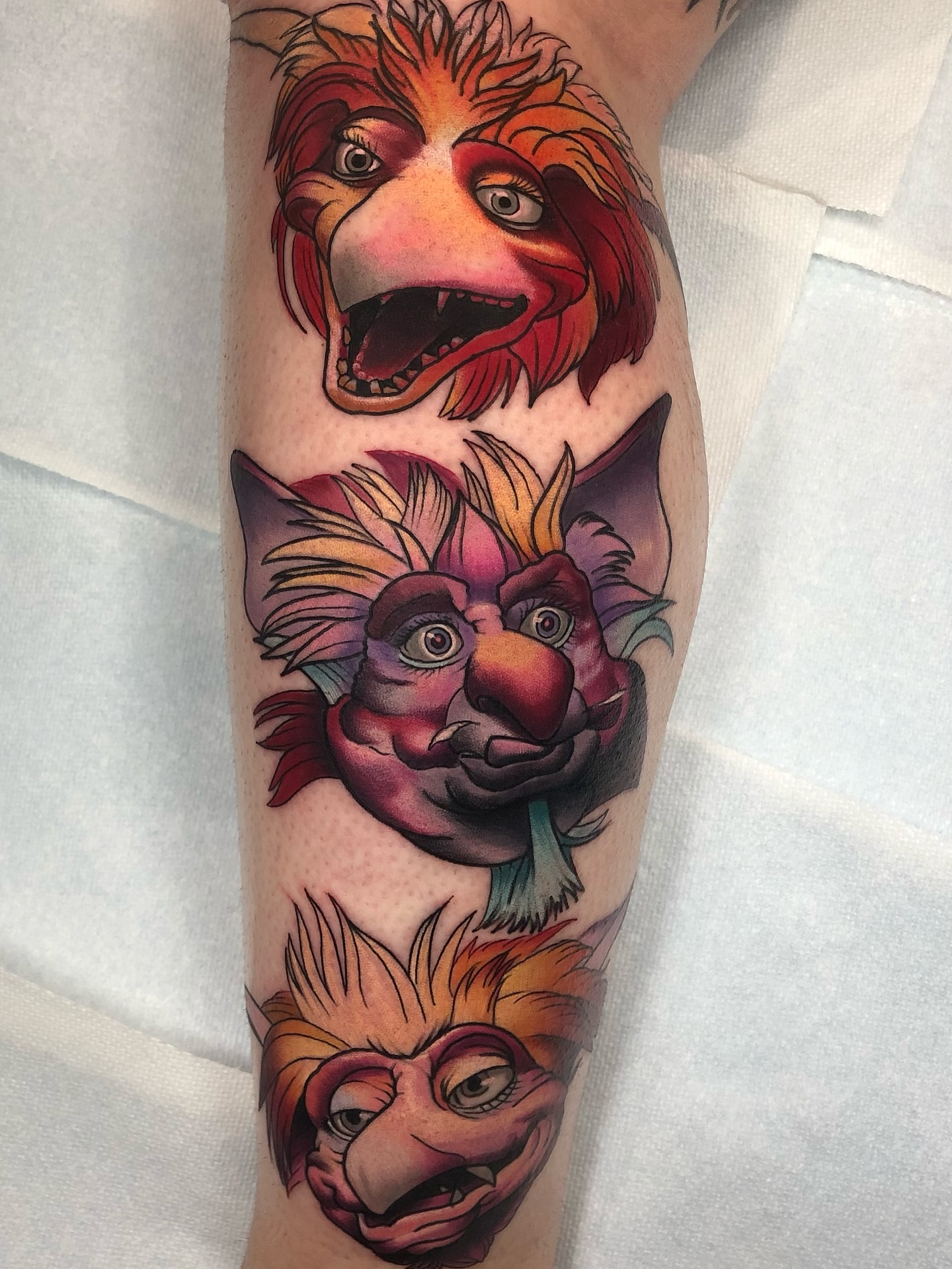 Lion heads realism tattoo on the forearm by Emily Walker