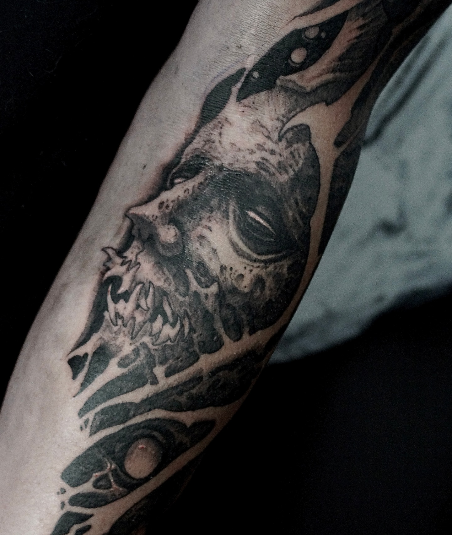 Skull black and grey tattoo on the forearm by Jamie