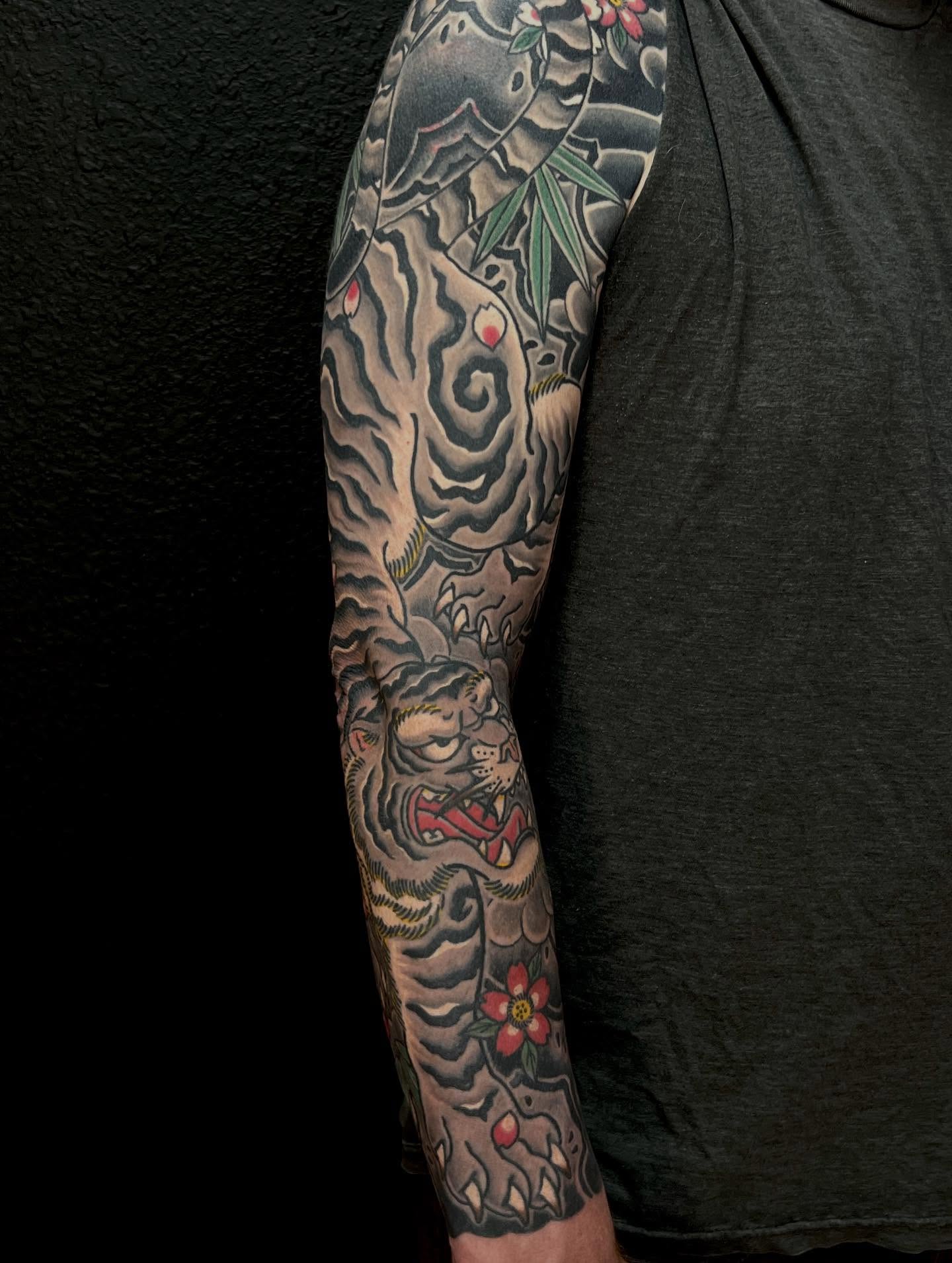 Tiger and floral japanese irezumi tattoo on the forearm by Rocky Burley, Georgetown, Texas