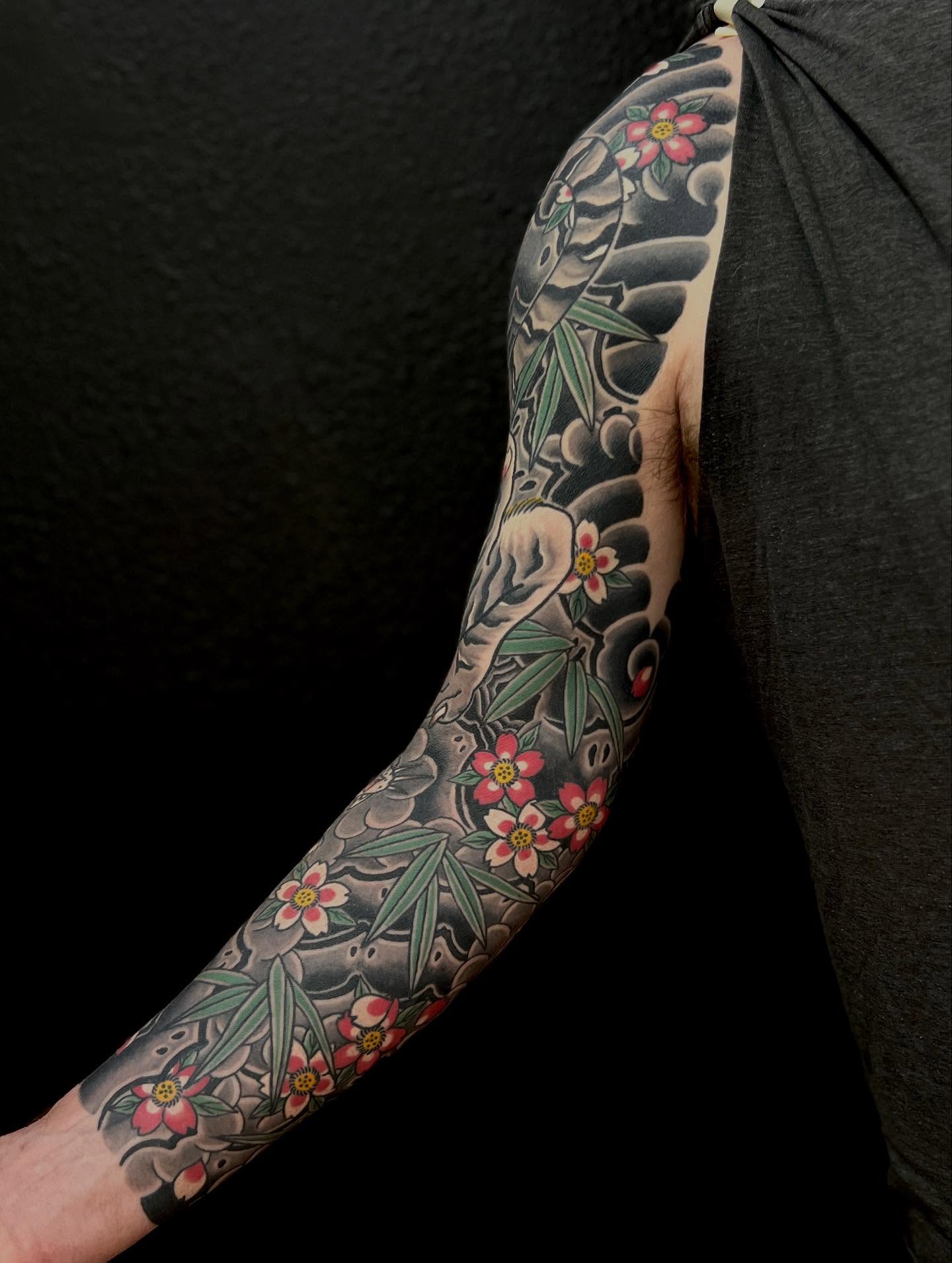 Cherry blossoms and bamboo japanese irezumi tattoo on the forearm by Rocky Burley, Georgetown, Texas