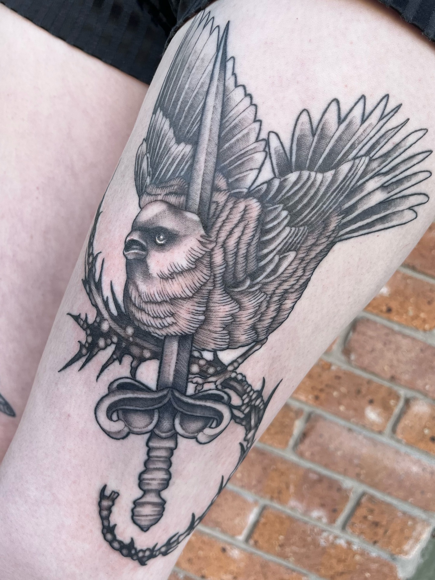 Eagle and sword realism tattoo on the thigh by Myla Jane, Houston, Texas