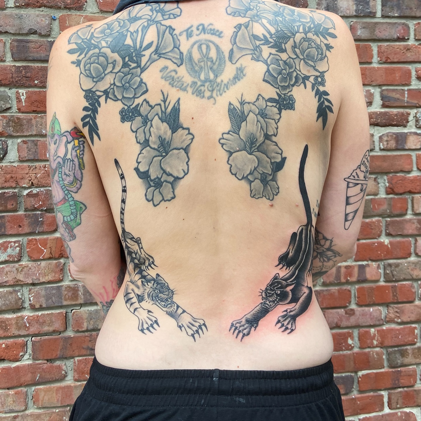 Floral and animal American traditional tattoo on the back by Anthony Robles
