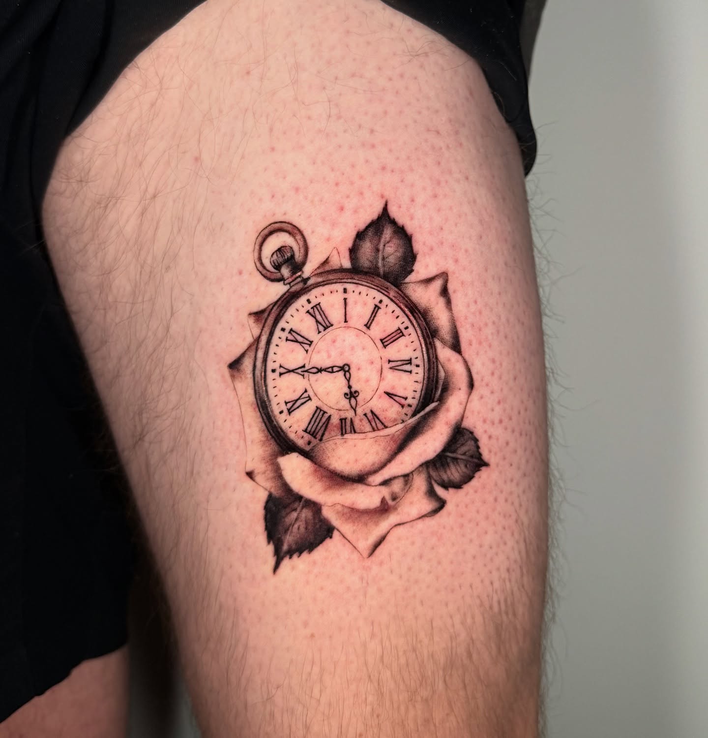 Clock in rose realism tattoo on the thigh by Moi Rivas, Salt Lake City, Utah