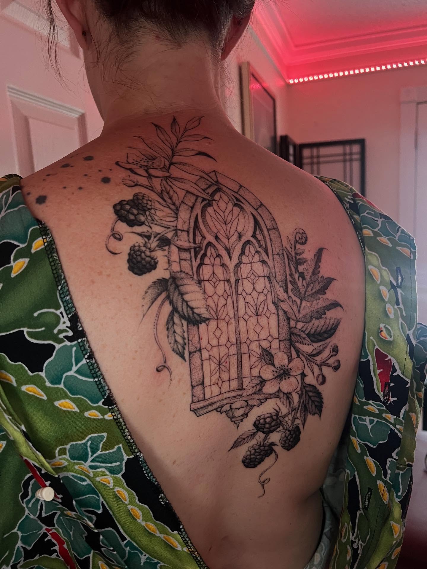 Gothic window with flora geometric tattoo on the back by Natasha