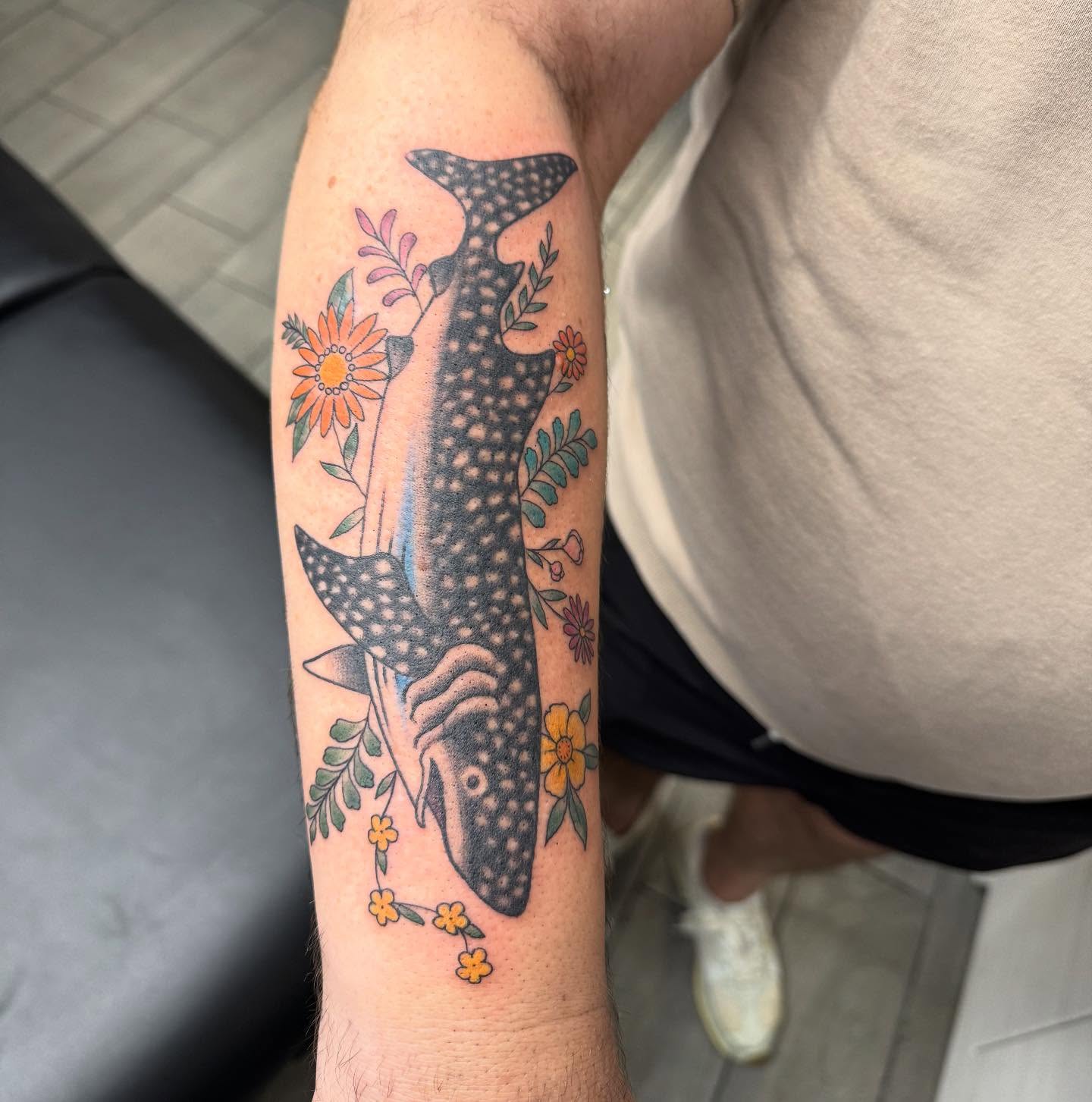 Whale shark with floral elements dotwork tattoo on the forearm by Joey Flaherty
