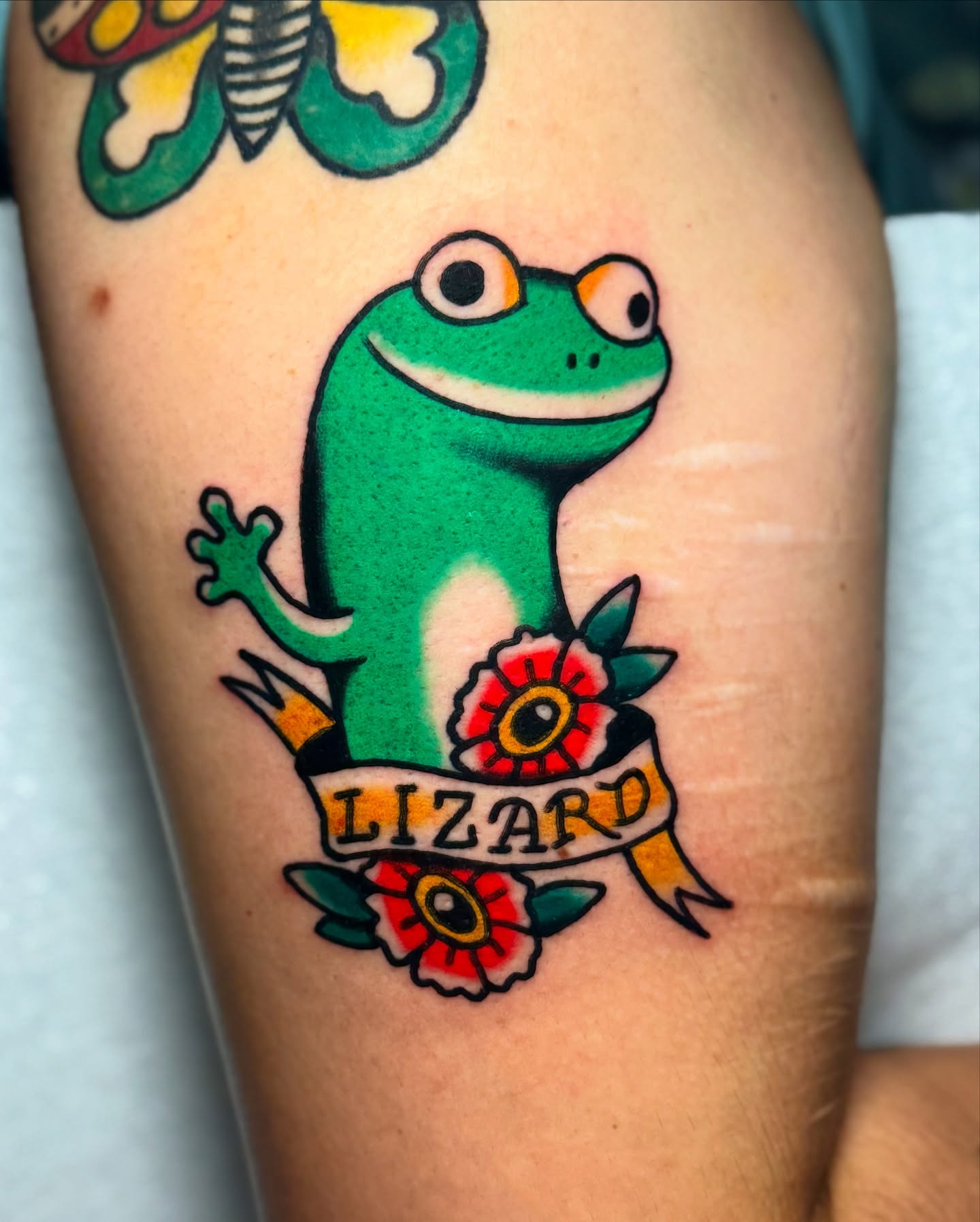 Lizard American traditional tattoo on the thigh by Javin Klingelhoefer Mosley