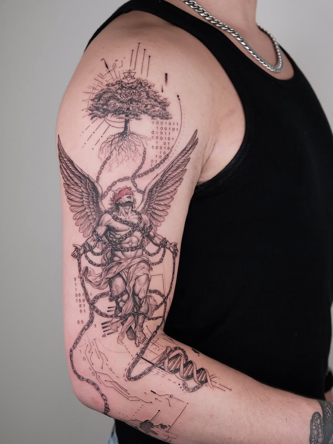 Realism tattoo on the upper arm by Zay - Realistic tattoo Artist