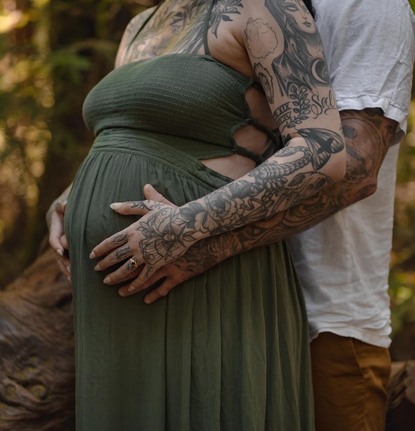 Pregnancy black and grey tattoo on the torso by Zoe D