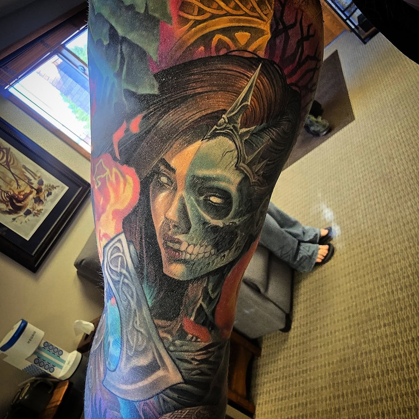 Woman with skull realism tattoo on the forearm by Alexander L. Wolff, Rapid City, South Dakota
