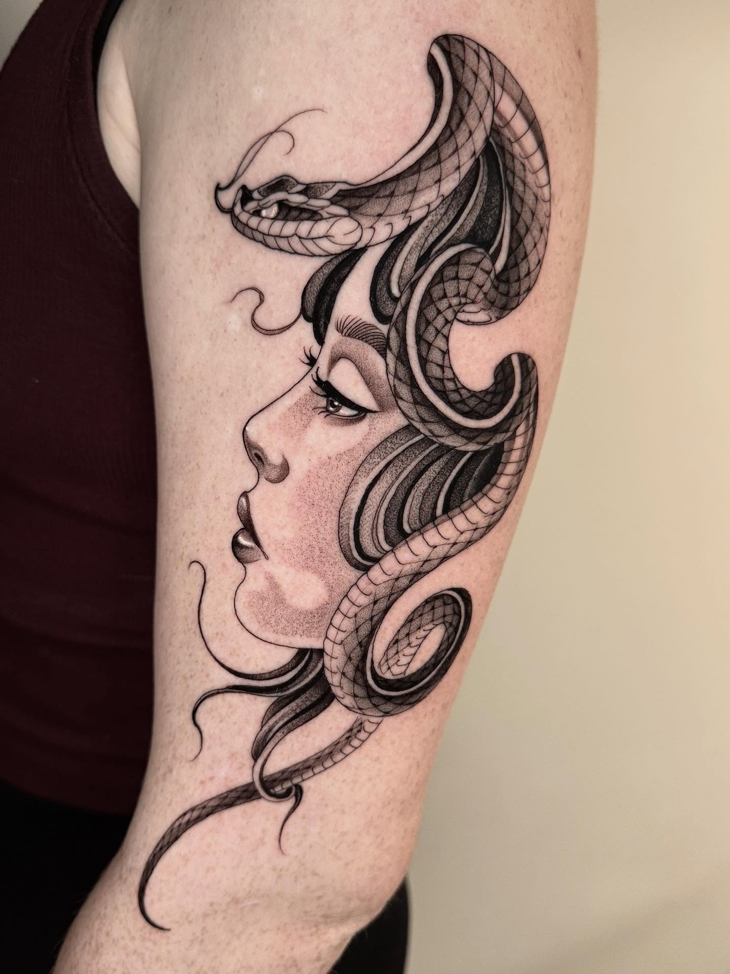 Woman with snakes realism tattoo on the forearm by Las Vegas Tattoo Artist