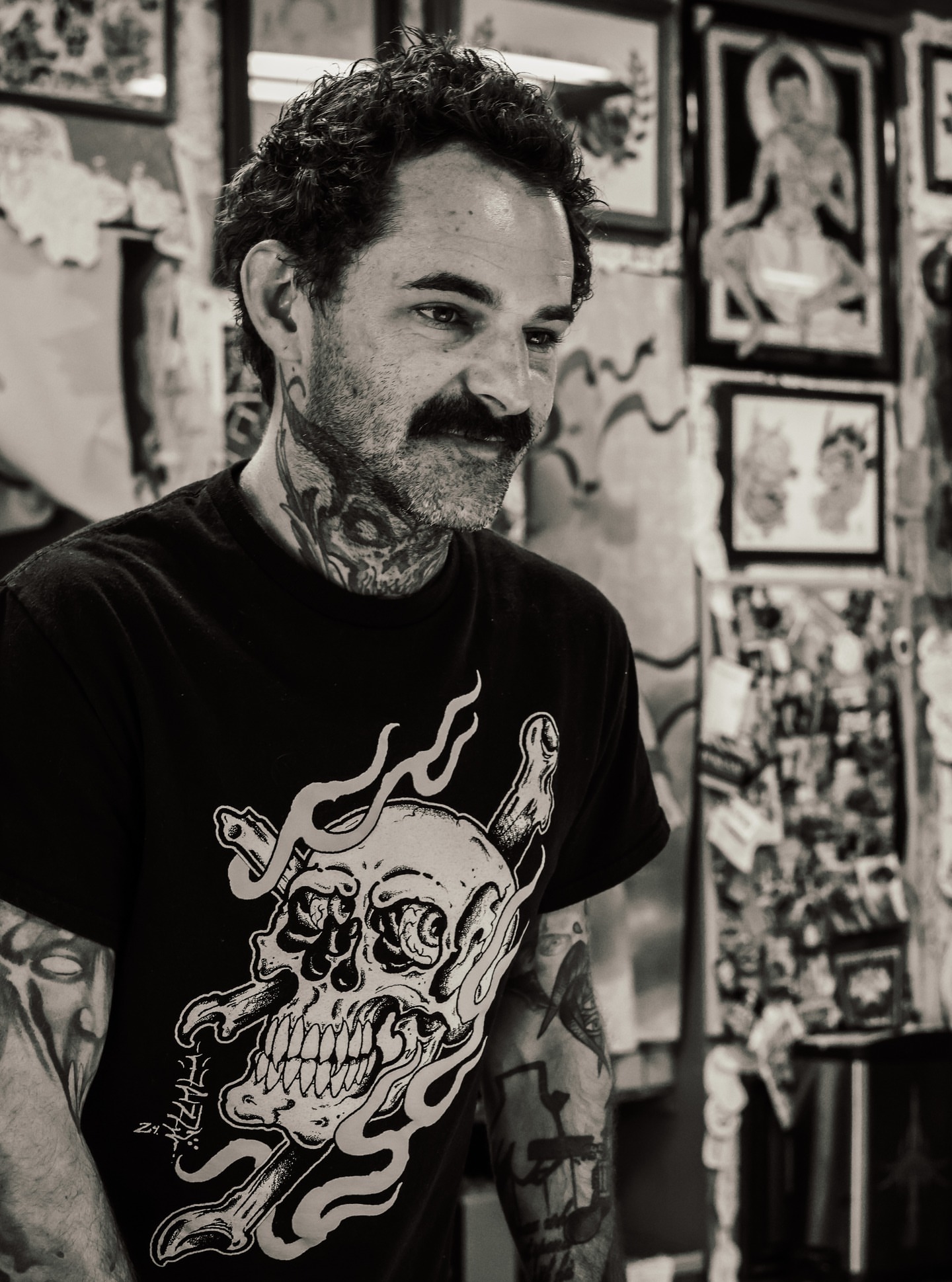 Skull with flames black and grey tattoo on the torso by Kennedy Cole
