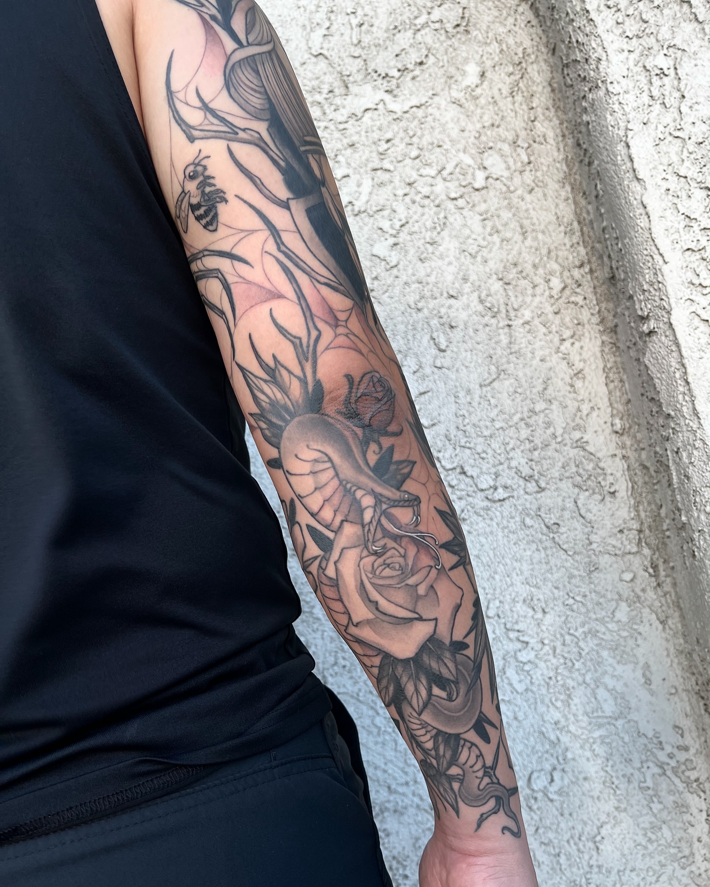 Rose and snake realism tattoo on the forearm by Las Vegas Tattoo Artist