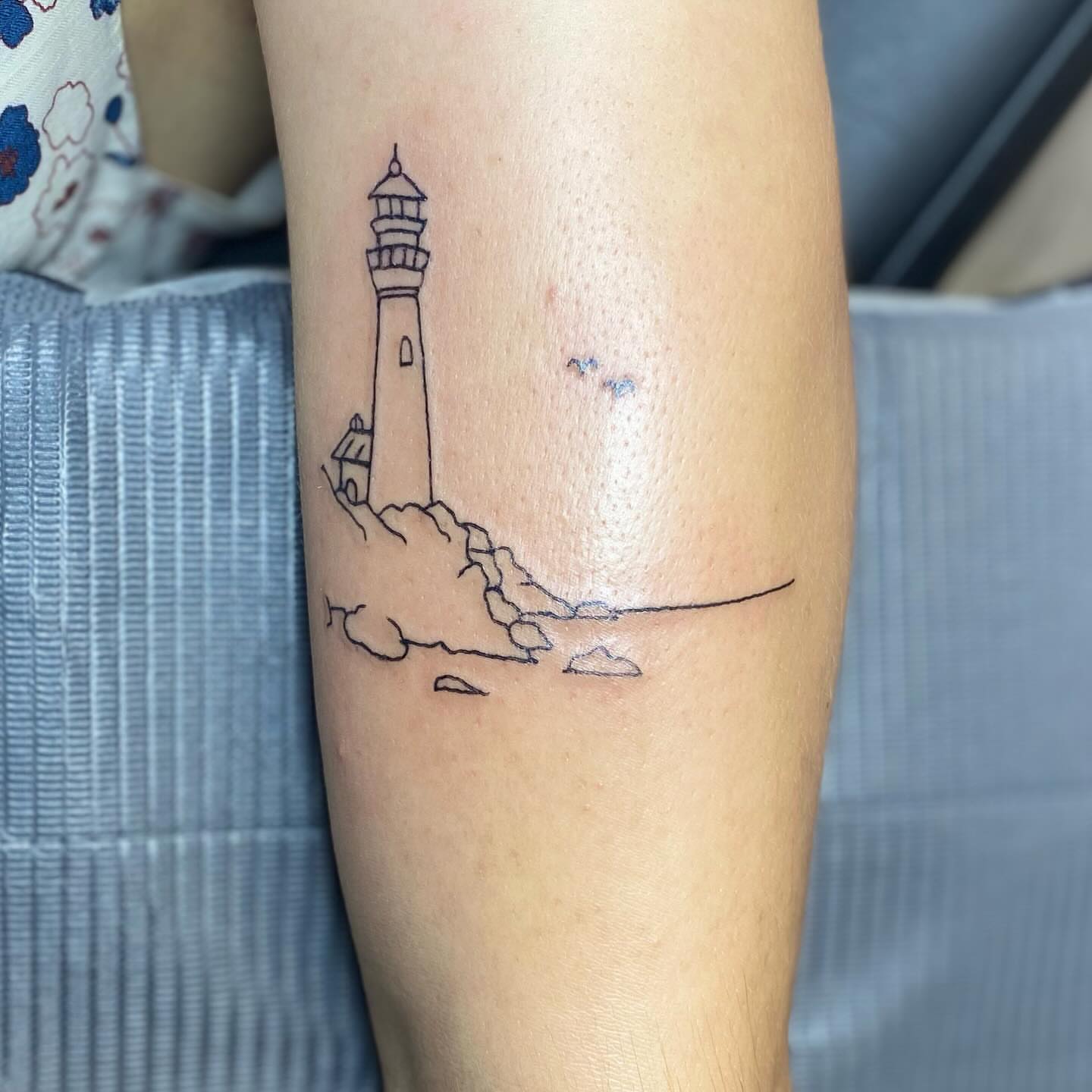 Lighthouse minimalist tattoo on the forearm by MD Ariel🦷