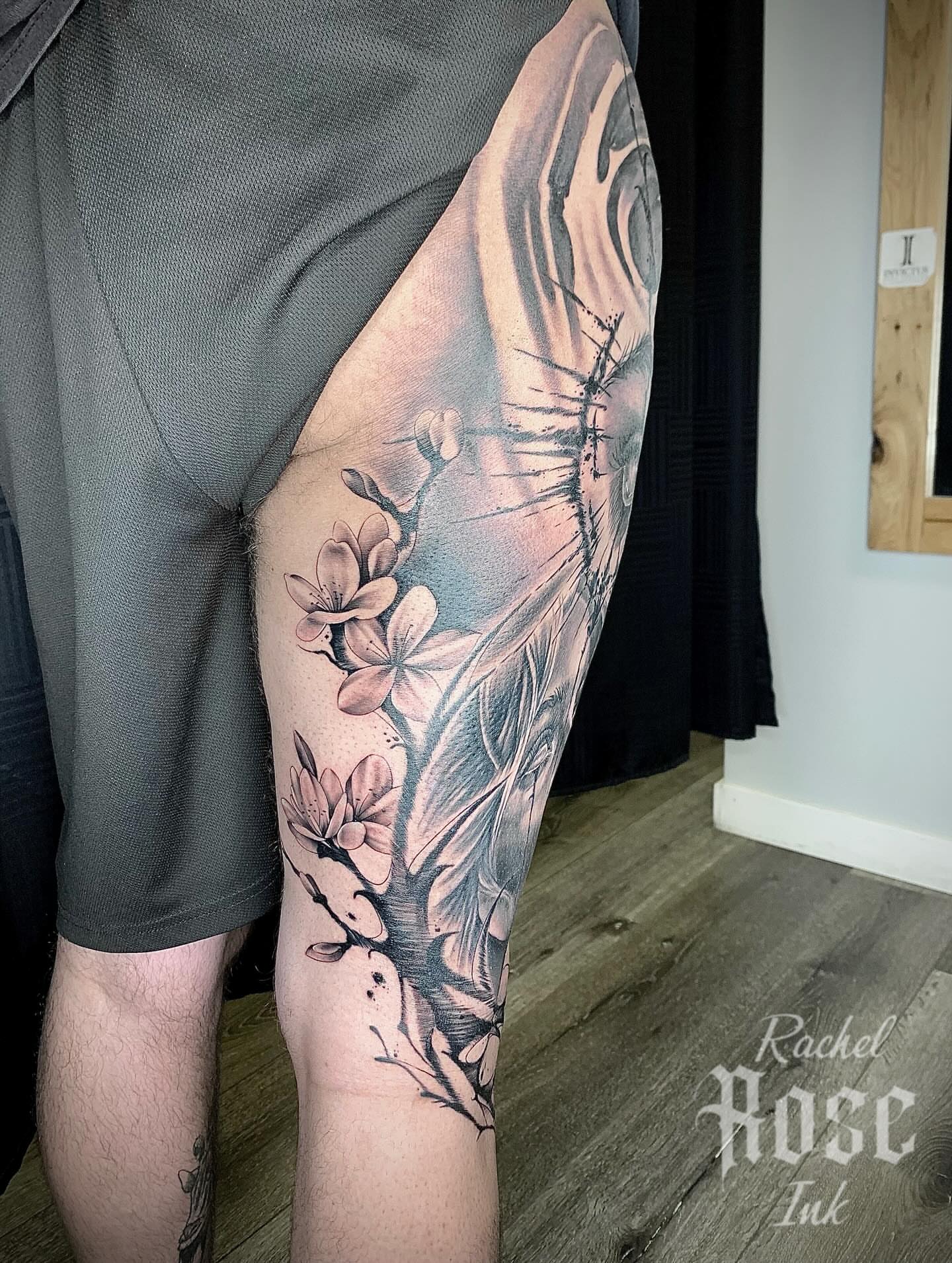 Cherry blossoms and bird realism tattoo on the thigh by 𝑅𝒶𝒸𝒽𝑒𝓁 𝑅𝑜𝓈𝑒 🌹