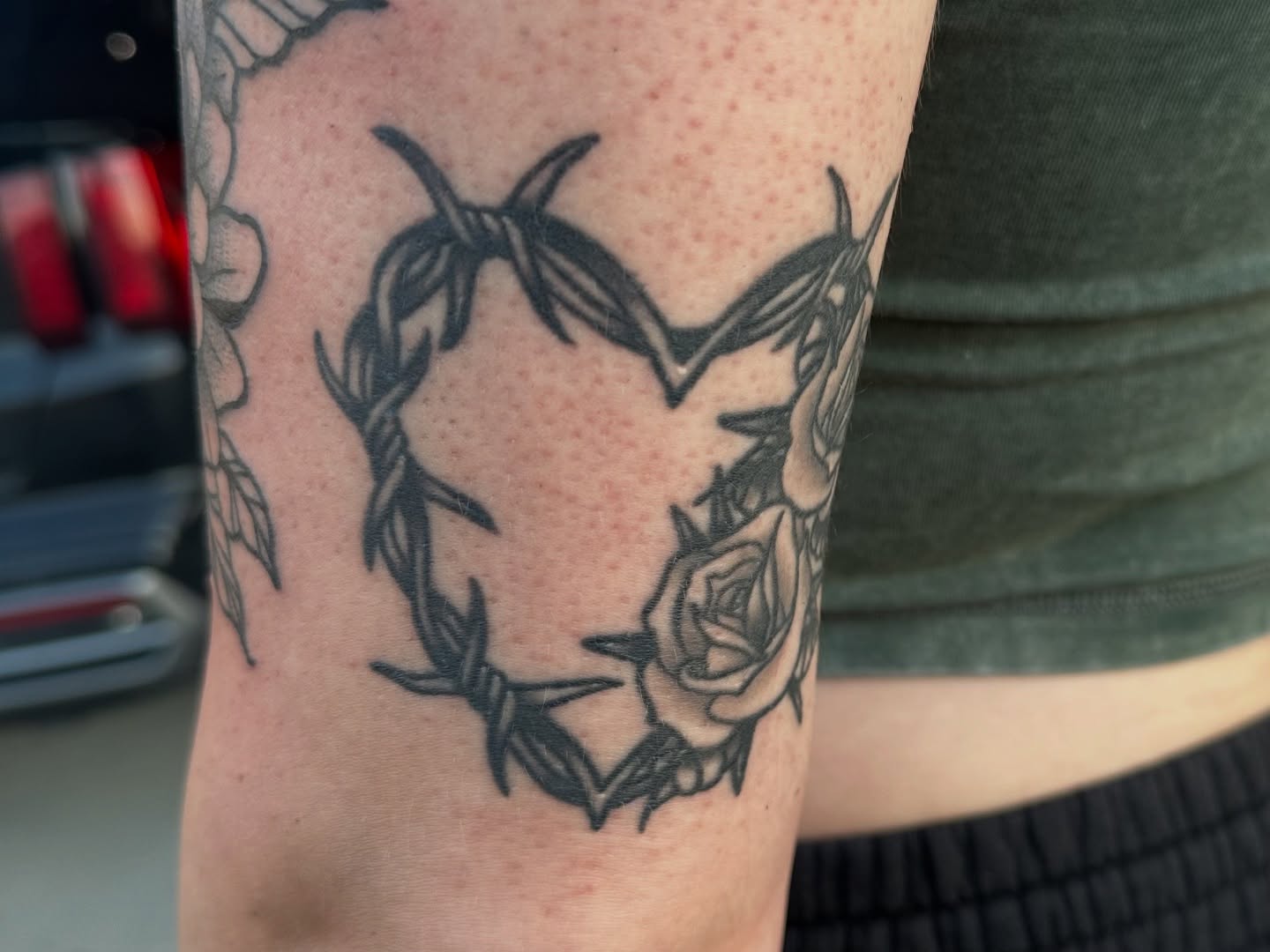 Barbed wire heart black and grey tattoo on the forearm by Ash Nicole Painterly, San Diego, California