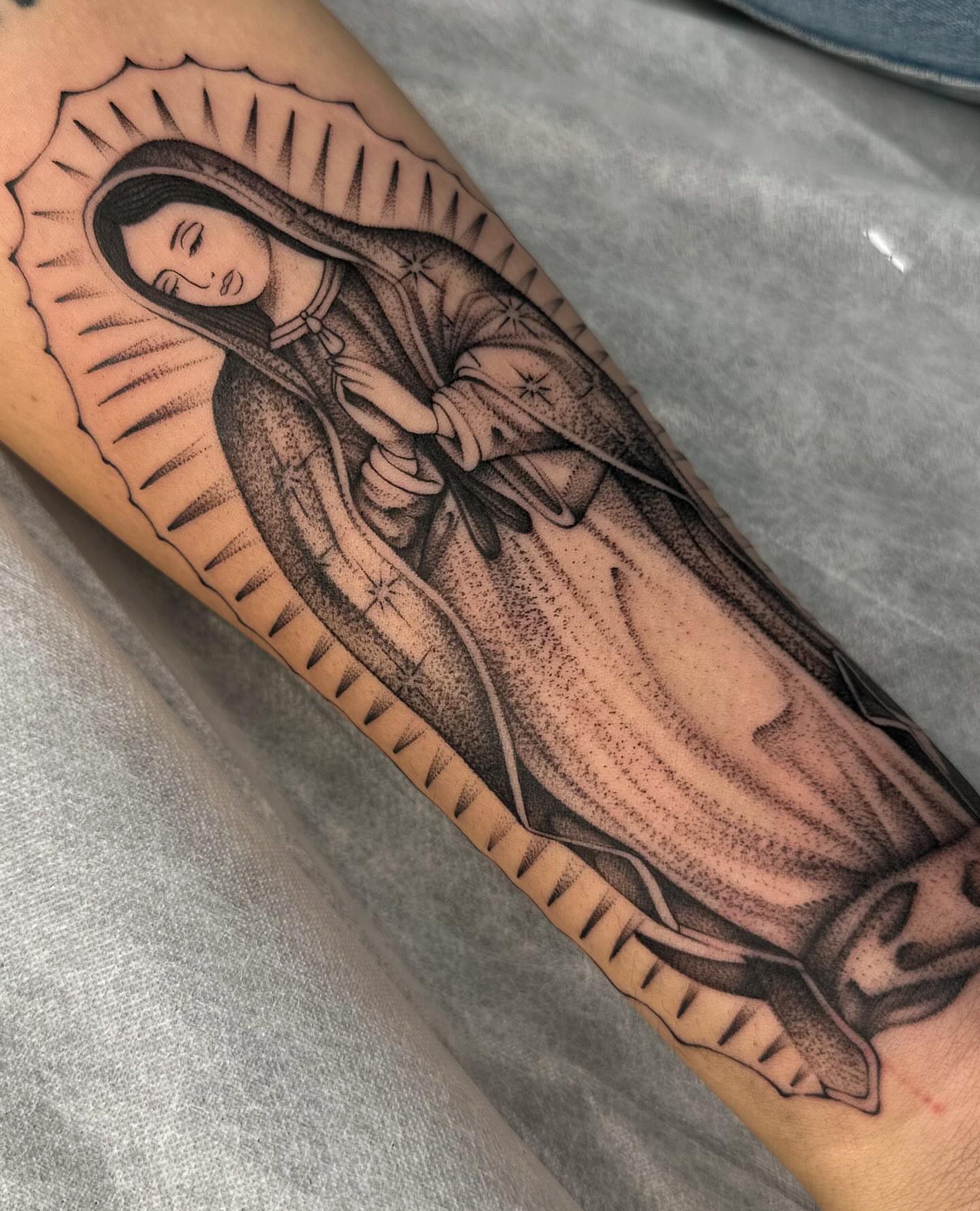 Virgin mary dotwork tattoo on the forearm by Maggie Angulo