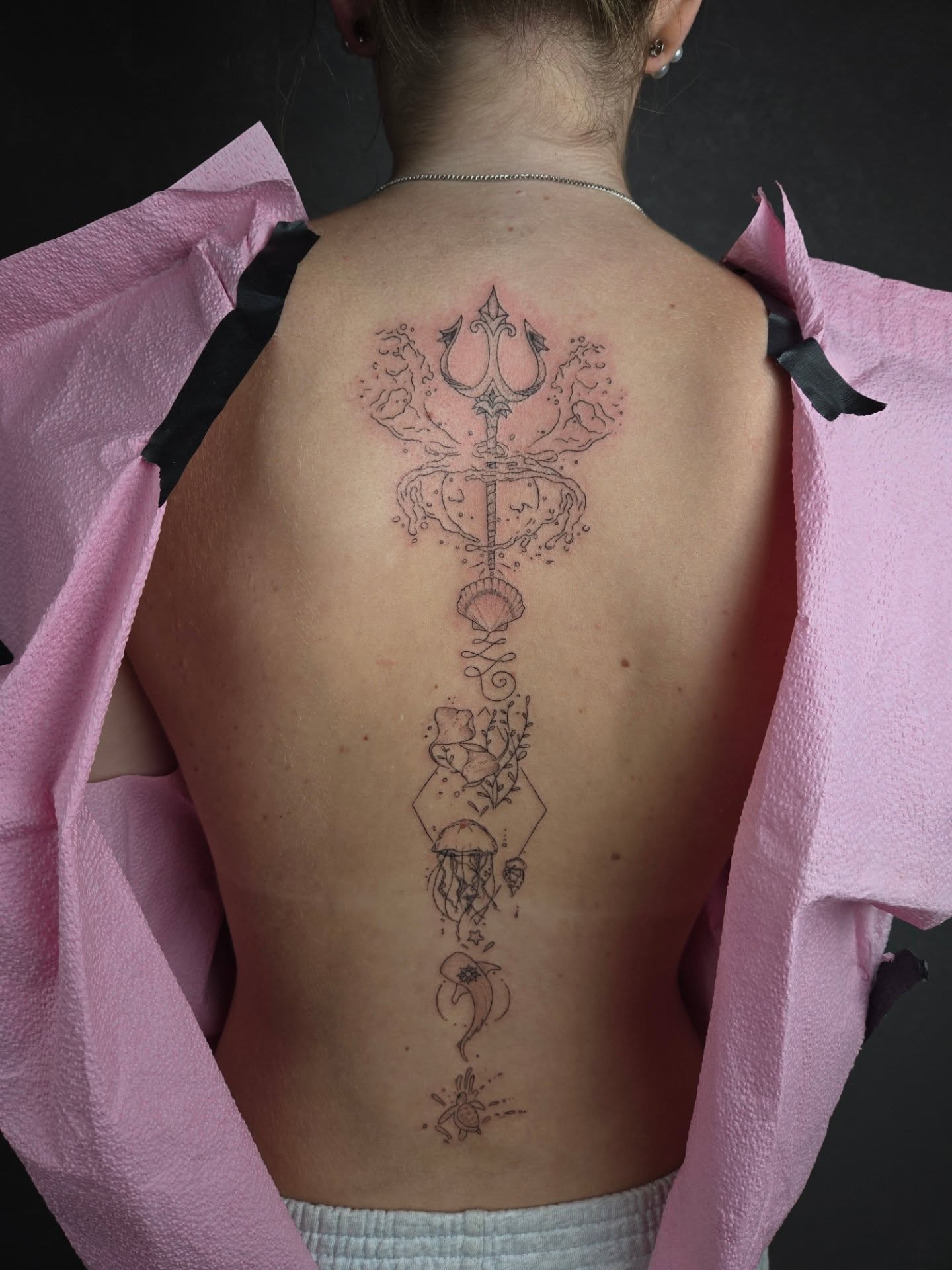 Nautical theme geometric tattoo on the back by Amy Heath