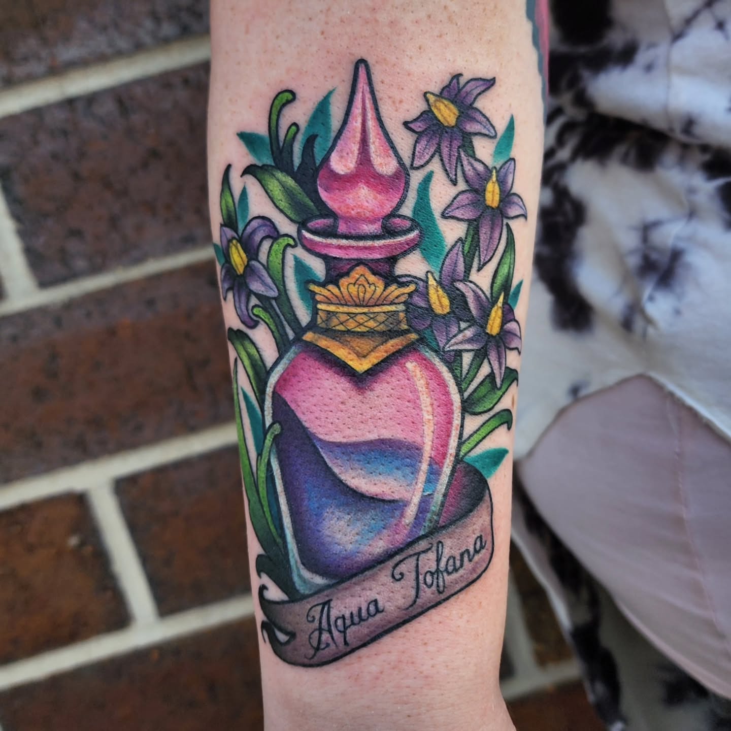 Aqua Tofana American traditional tattoo on the forearm by Shawna Goettsche