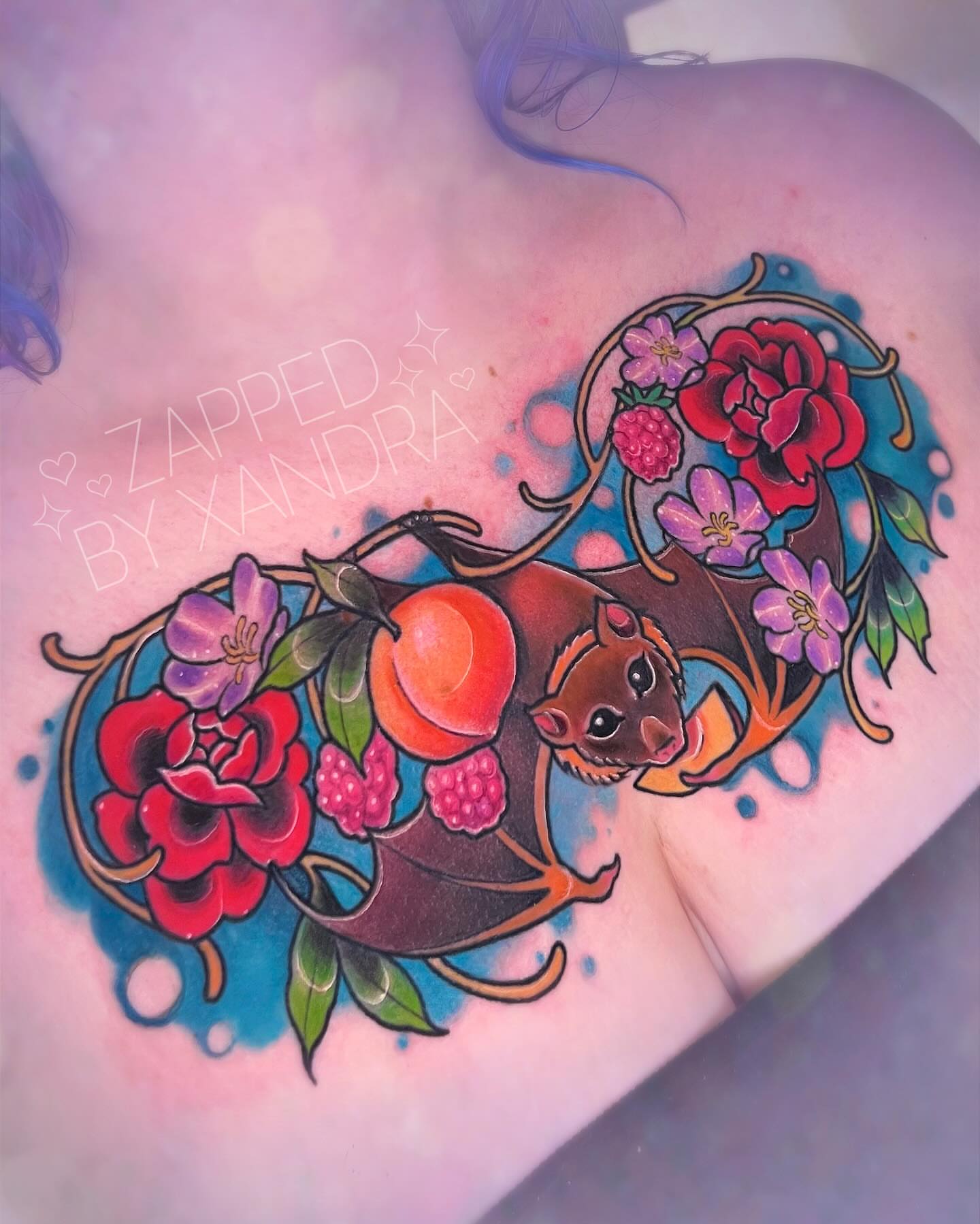 Bat and floral arrangement American traditional tattoo on the back by ๐๐ข๐ฏ๐ฅ๐ณ๐ข
