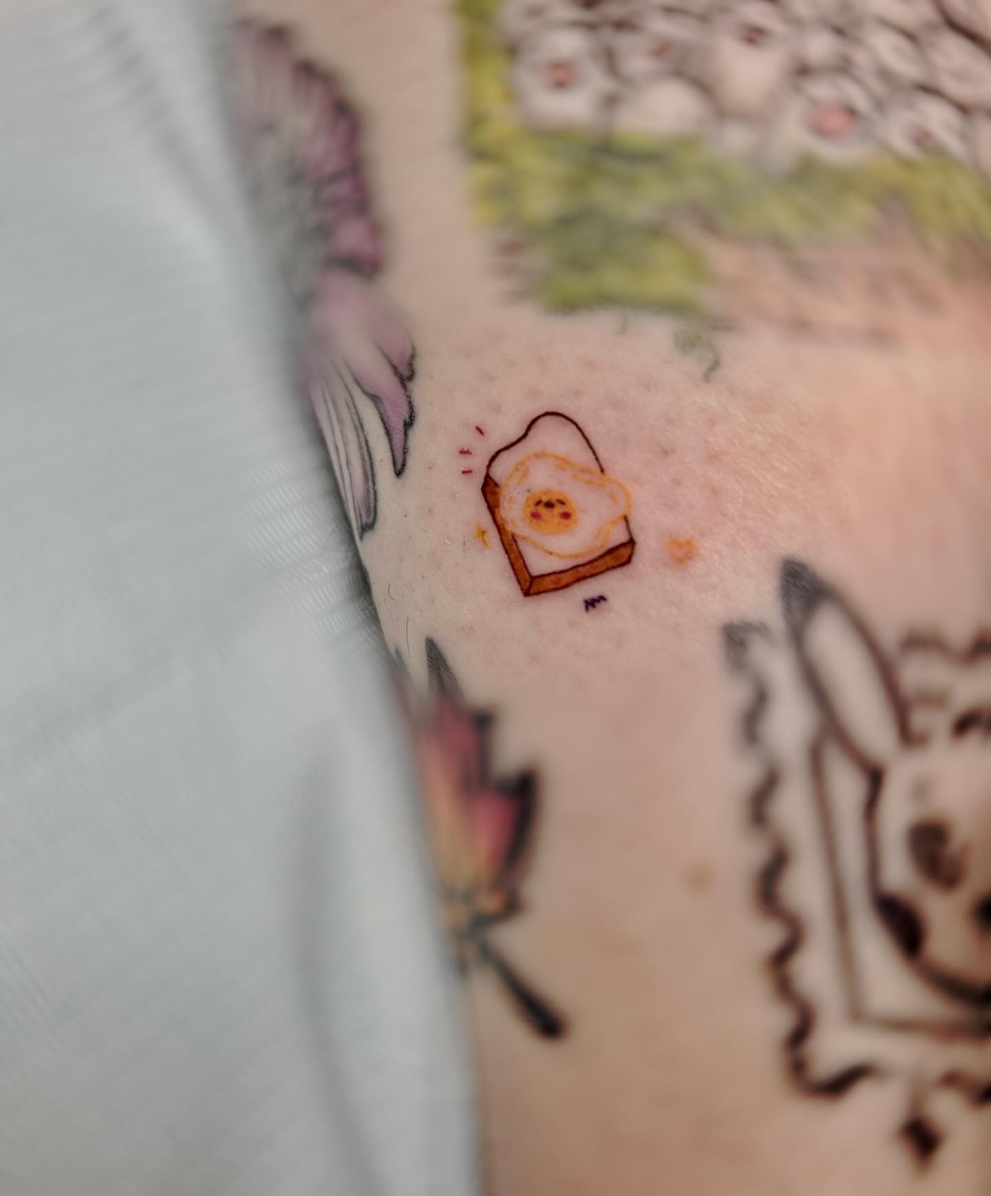 Egg sandwich dotwork tattoo on the forearm by Kite.Tattoo_Amber