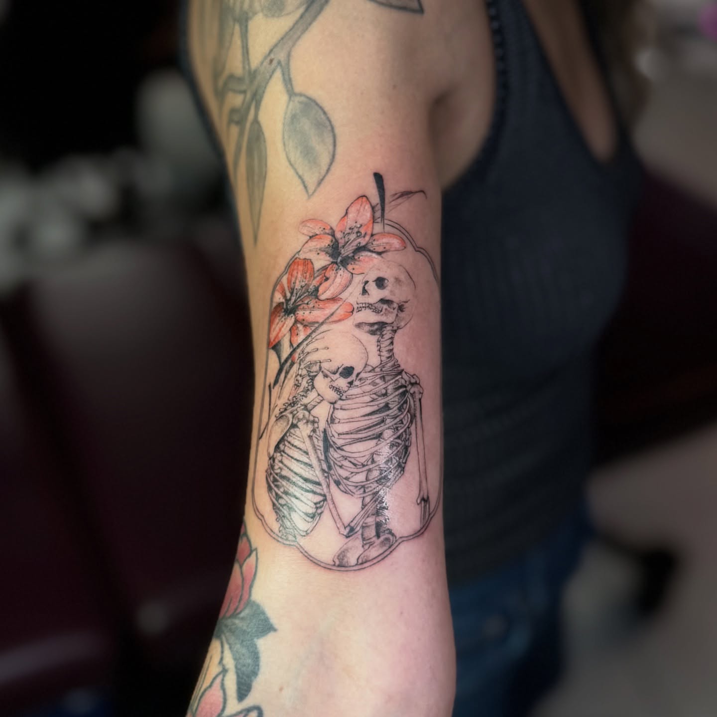 Skeleton with flowers realism tattoo on the forearm by B o n d B o n d , “ a r t i s t “