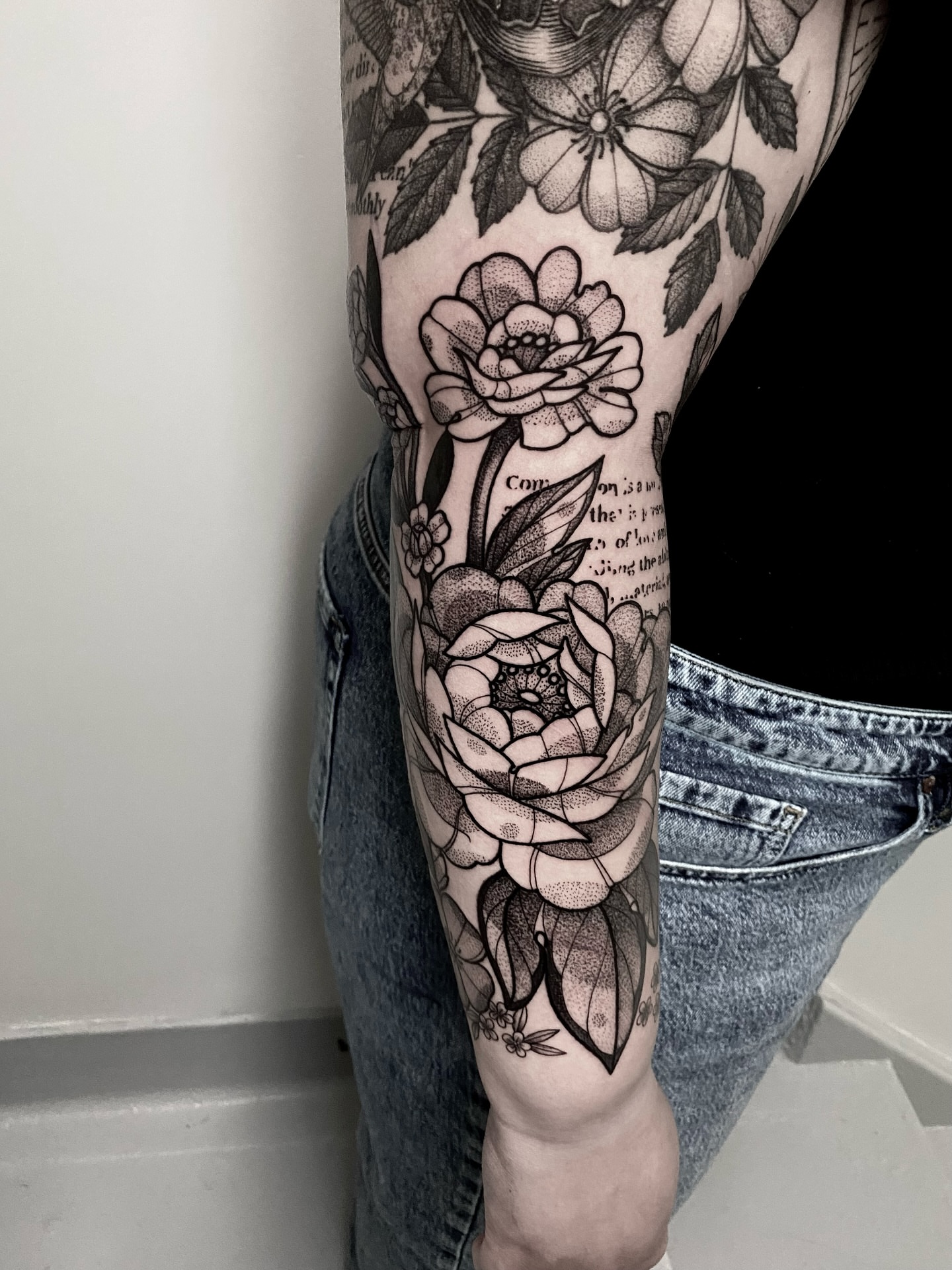 Floral bouquet American traditional tattoo on the forearm by Rowan Starr