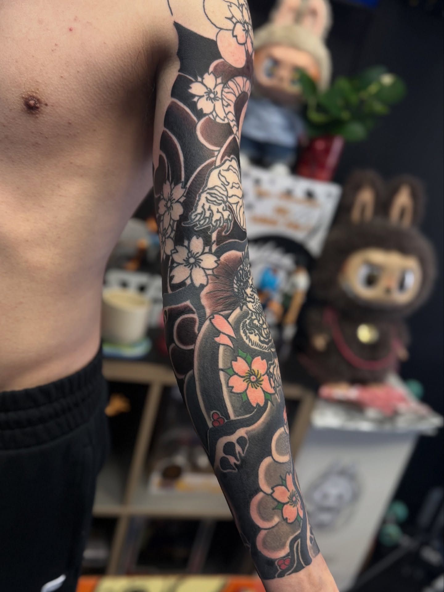 Cherry blossoms and skull japanese irezumi tattoo on the forearm by Zack Yang, Houston, Texas
