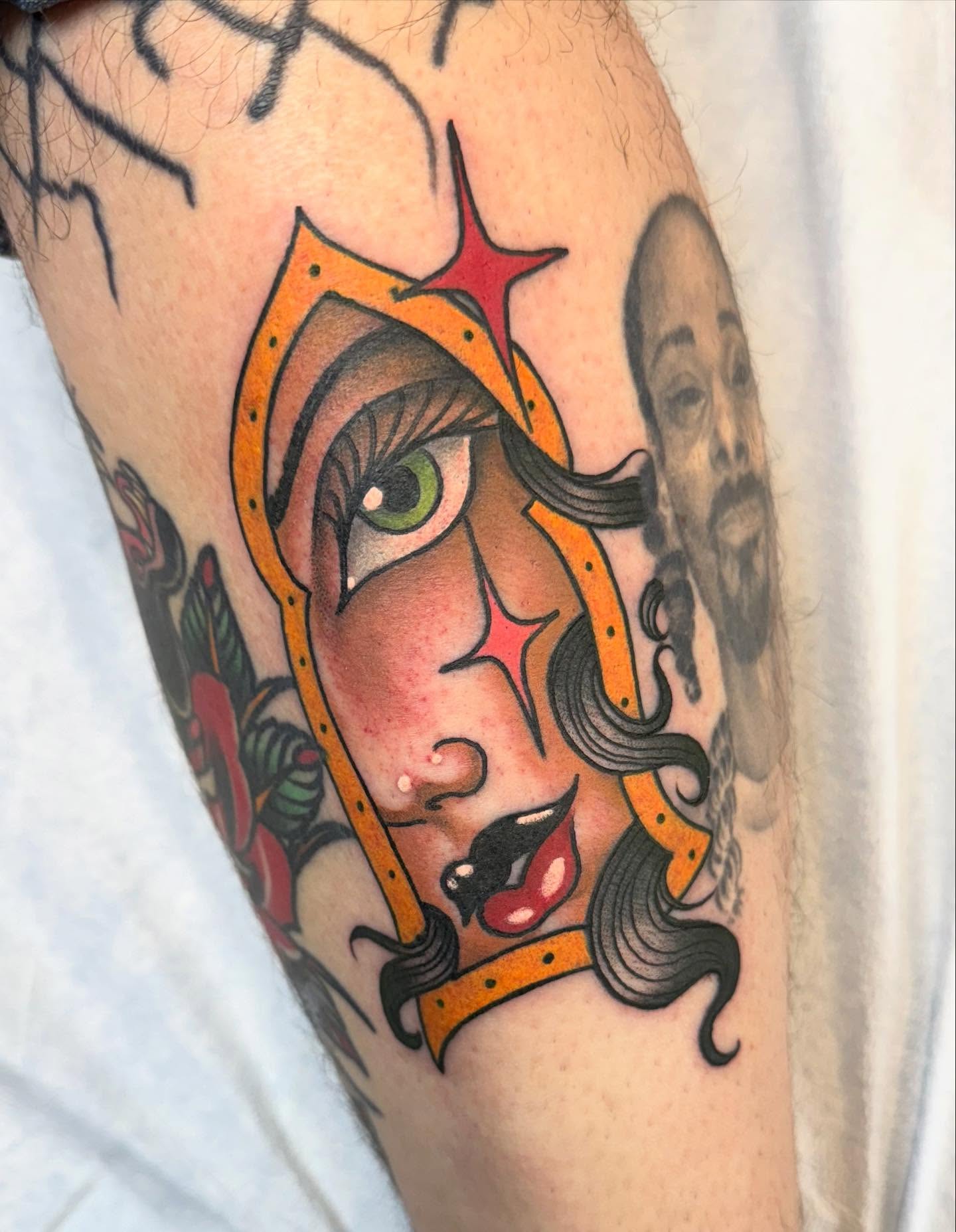 Woman's face American traditional tattoo on the forearm by Jason Lawyer