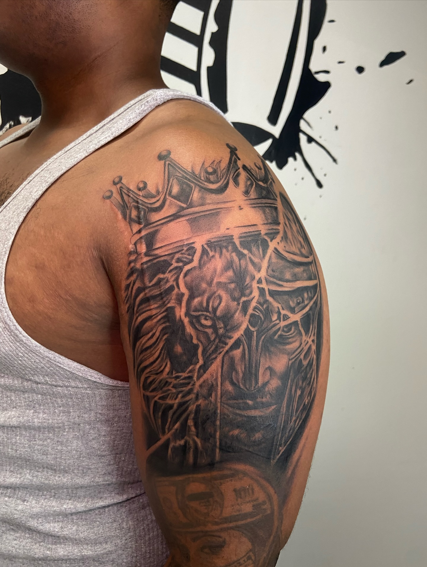 Lion with crown realism tattoo on the shoulder by Chicago Tattoo Artist