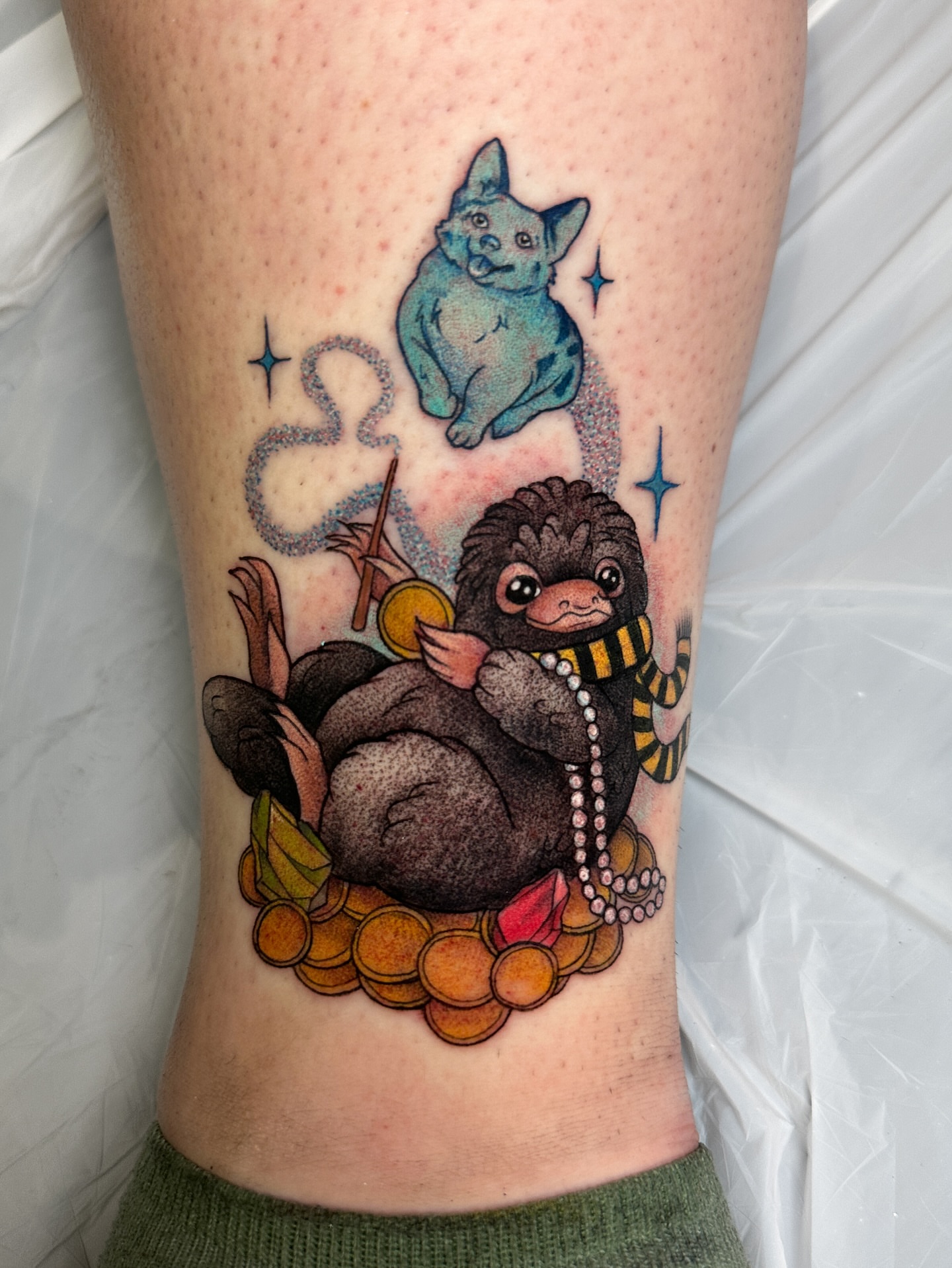 Sloth with coins dotwork tattoo on the leg by caliope yiannos